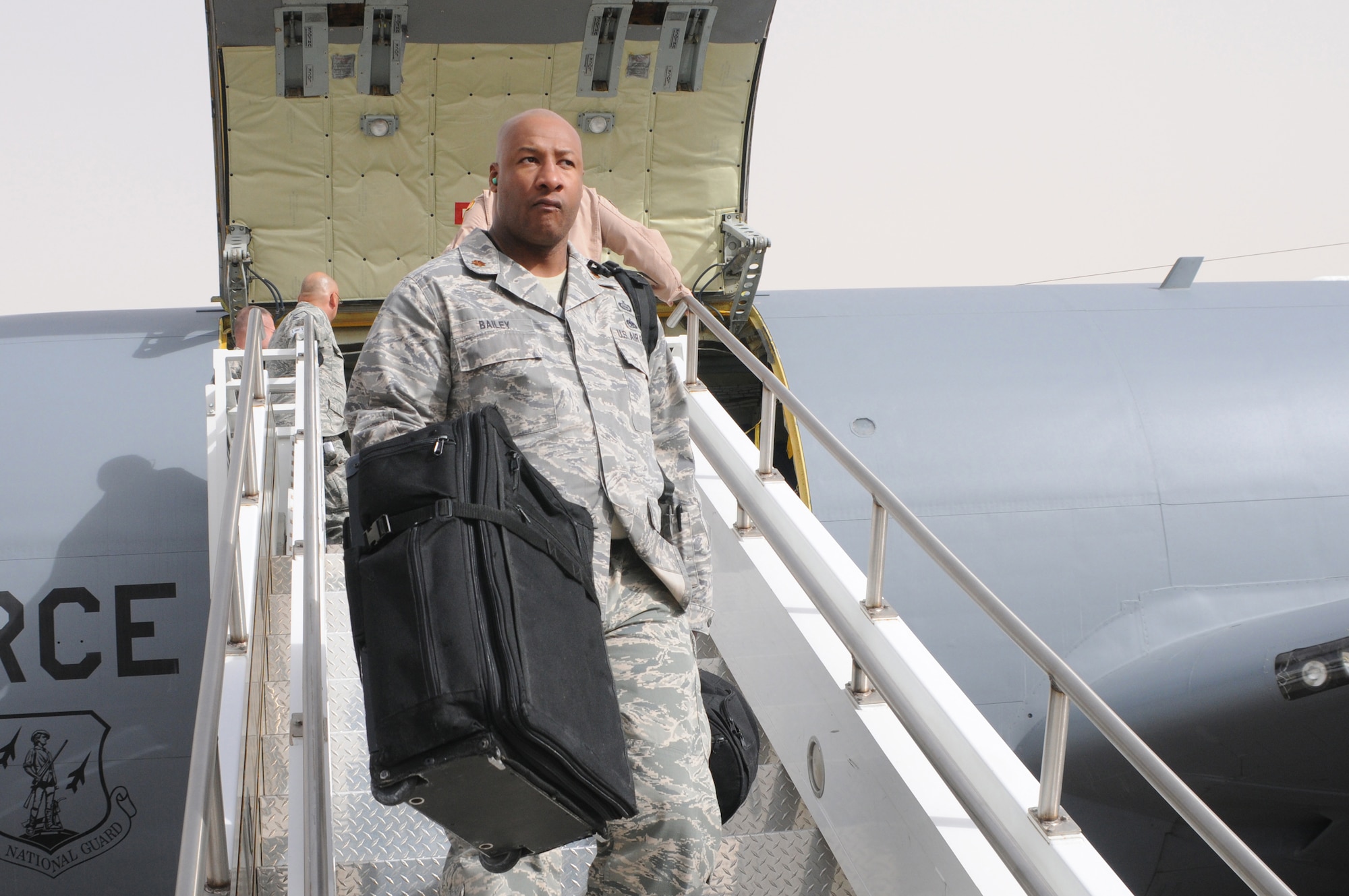 PHOENIX, AZ -- Major Torrence Bailey, Intelligence Officer for the 161st Air Refueling Wing, returns from a deployment in support of Operation Iraqi Freedom, Nov. 4, 2011. Major Bailey was assigned to the 379th Air Expeditionary Wing, 340th Expeditionary Air Refueling Squadron in Southwest Asia. (U.S. Air Force photo/Master Sgt. Charles Wade)