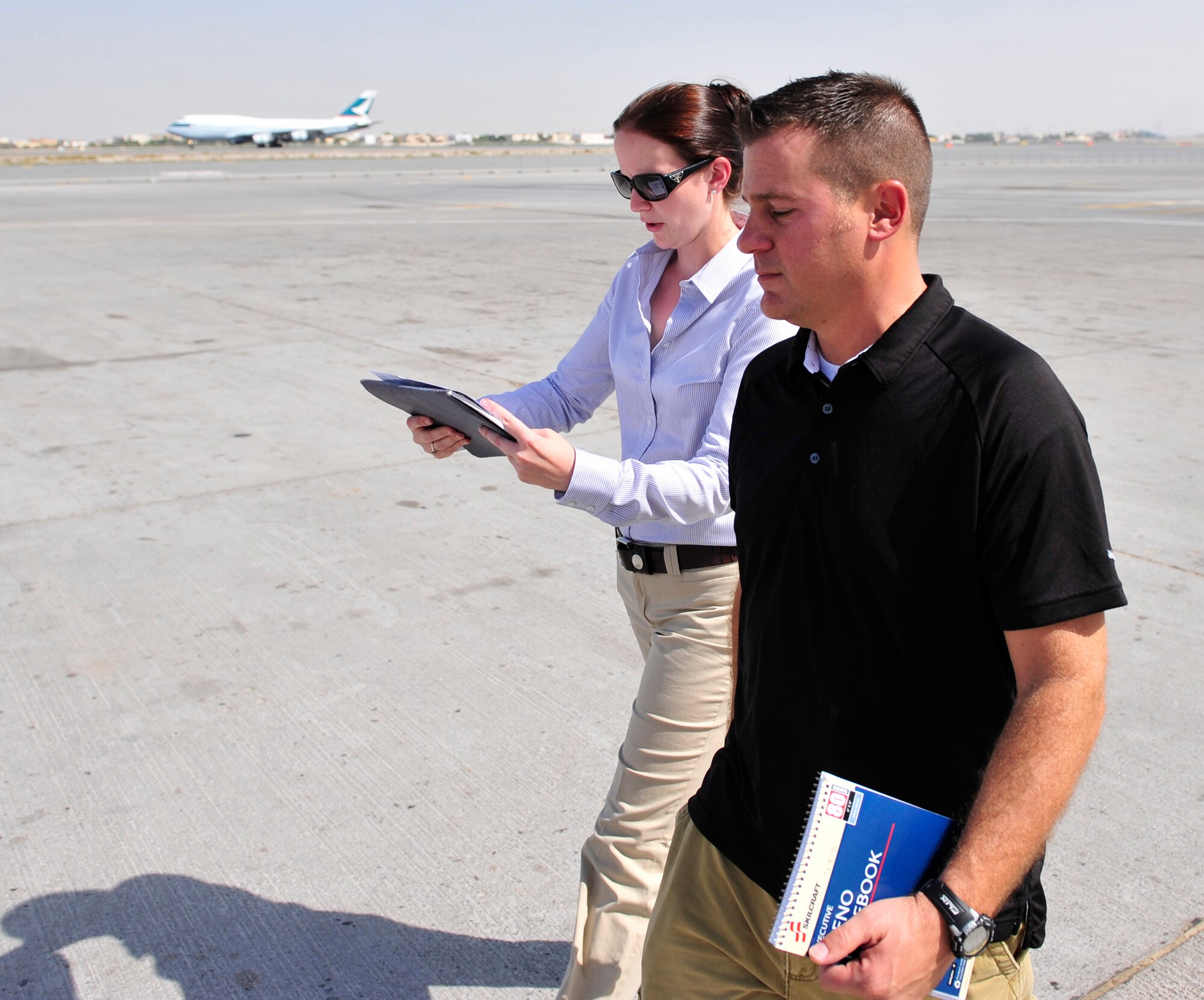 Master Sgt. Chance Babin 380th Air Expeditionary Wing public affairs superintendent interviews Capt. Julia Palmer 380th AEW Maintenance Squadron lead. Capt. Palmer is responsible for military aircraft positioning and over all airfield operations for the Airforce portion of the 2011 Dubai Airshow.  The Airshow will highlight a variety of U.S. Air Force, Navy and Army aircraft showcasing the range of U.S. military airpower capabilities. Aircrew and support personnel from bases in the gulf region, Europe and the U.S. are participating in the event, which is expected to draw more than 55,000 visitors.  (U.S. Air Force Photo/Tech. Sgt. Patrick Mitchell)