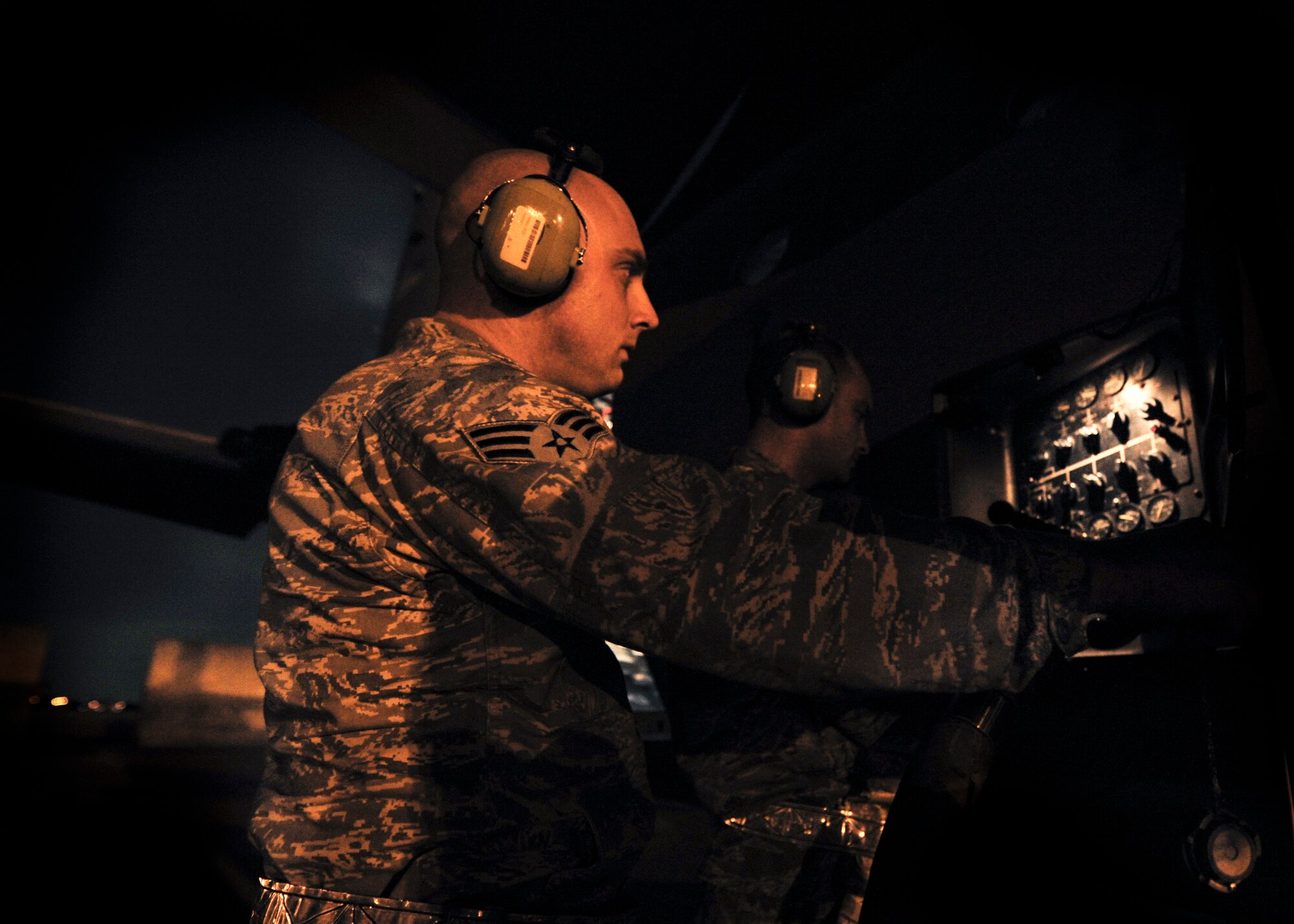 YOKOTA AIR BASE, Japan -- Staff Sgt. Kenneth Massey (right) and Senior Airman Loren Martin, 374th Maintenance Squadron refuel a C-130 during a operational readiness inspection at Yokota Air Base, Japan, Nov. 8, 2011. The ORE tests Airmen's knowledge and ability in a variety of areas in both the peacetime and wartime mission. (U.S. Air Force photo/Staff Sgt. Stacy Moless)