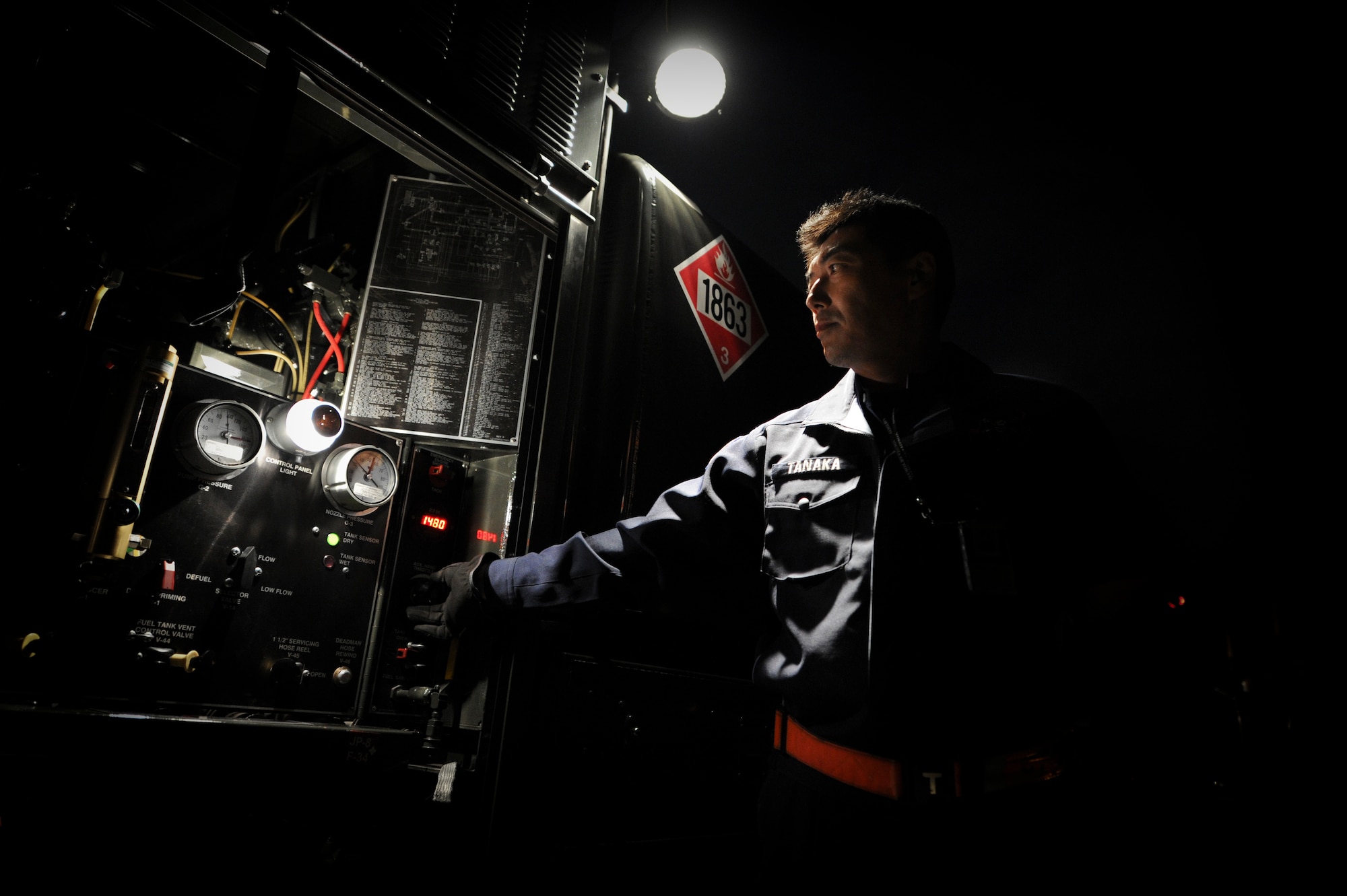 YOKOTA AIR BASE, Japan -- Mr. Tanaka, 374th Logistics Readiness Squadron, refuels a C-130 during a operational readiness inspection at Yokota Air Base, Japan, Nov. 8, 2011. The ORE tests Airmen's knowledge and ability in a variety of areas in both the peacetime and wartime mission. (U.S. Air Force photo/Staff Sgt. Stacy Moless)

