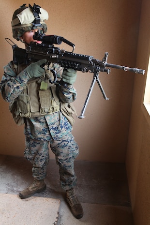 Pfc. Andrey Zhirnov, a rifleman with Alpha Company, 1st Battalion, 2nd Marine Regiment, holds security while conducting training during the Mechanized Raid Course Nov. 9, at the Military Operations Urban Terrain training facility aboard Camp Lejeune. The course took place Nov. 7-18 to prepare the company to serve as the 24th Marine Expeditionary Unit's mechanized raid force.