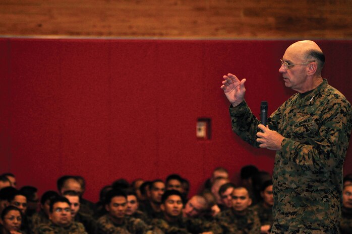 Lt. Gen. Duane D. Thiessen, commander of U.S. Marine Corps Forces, Pacific, speaks to a gym full of Marines on the House of Pain's basketball court on Camp Hansen, Nov. 9.