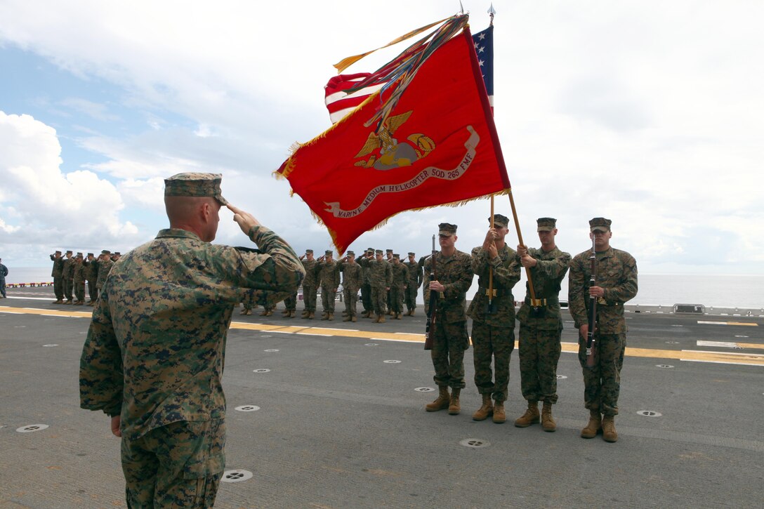 Lt. Col. Damien Marsh, the commanding officer of Marine Medium Helicopter Squadron 265 (Reinforced), 31st Marine Expeditionary Unit, salutes the colors during a birthday ceremony celebrating the Marine Corps 236th year. The 31st MEU is the nation’s only continually forward deployed MEU, and remains the United States' force in readiness in the Asia-Pacific region.