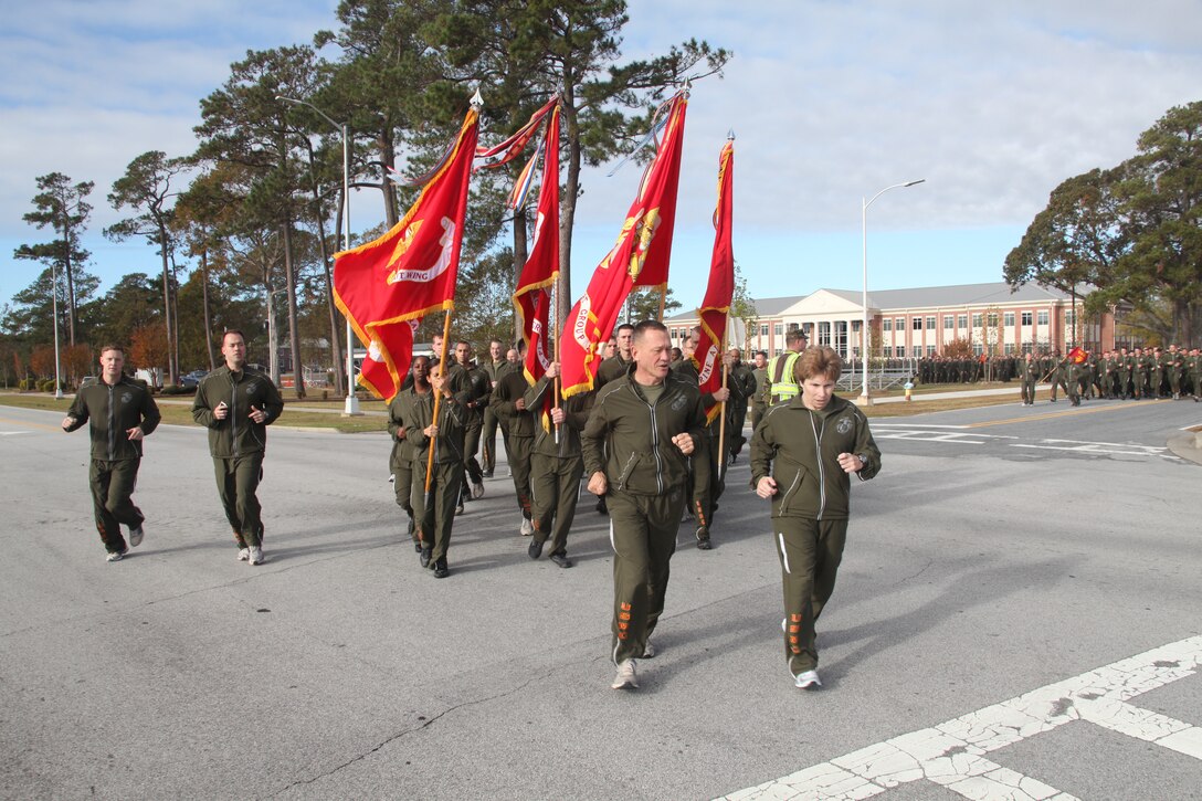 Maj. Gen. Jon M. Davis, commanding general of the 2nd Marine Aircraft Wing, and Sgt. Maj. Susan M. Bellis, sergeant major of 2nd MAW, lead their Marines on a run celebrating the birth of the Marine Corps 236 years ago on Nov. 10, 1775.