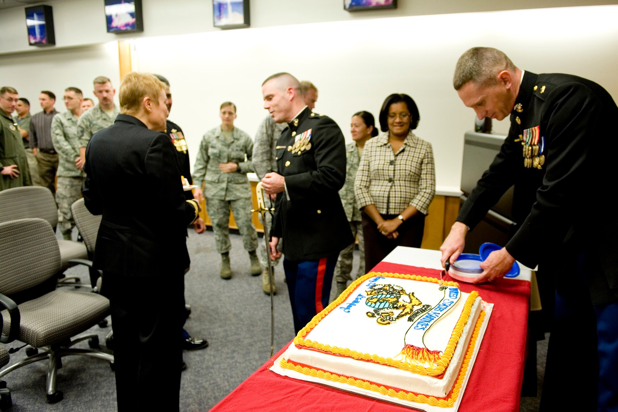 VANDENBERG AIR FORCE BASE, Calif. - Marine Corps Sgt. Christopher Pettingill, the youngest of four Marines assigned to the Joint Space Operations Center here, takes the ceremonial ?first-bite? of the cake for the celebration of the 236th Marine Corps birthday Thursday, Nov. 10, 2011. Formed in 1775, the USMC has served in every American armed conflict and has the unique ability to rapidly deploy a combined-arms task force to almost anywhere in the world within days. (U.S. Air Force photo/Staff Sgt. Levi Riendeau)
