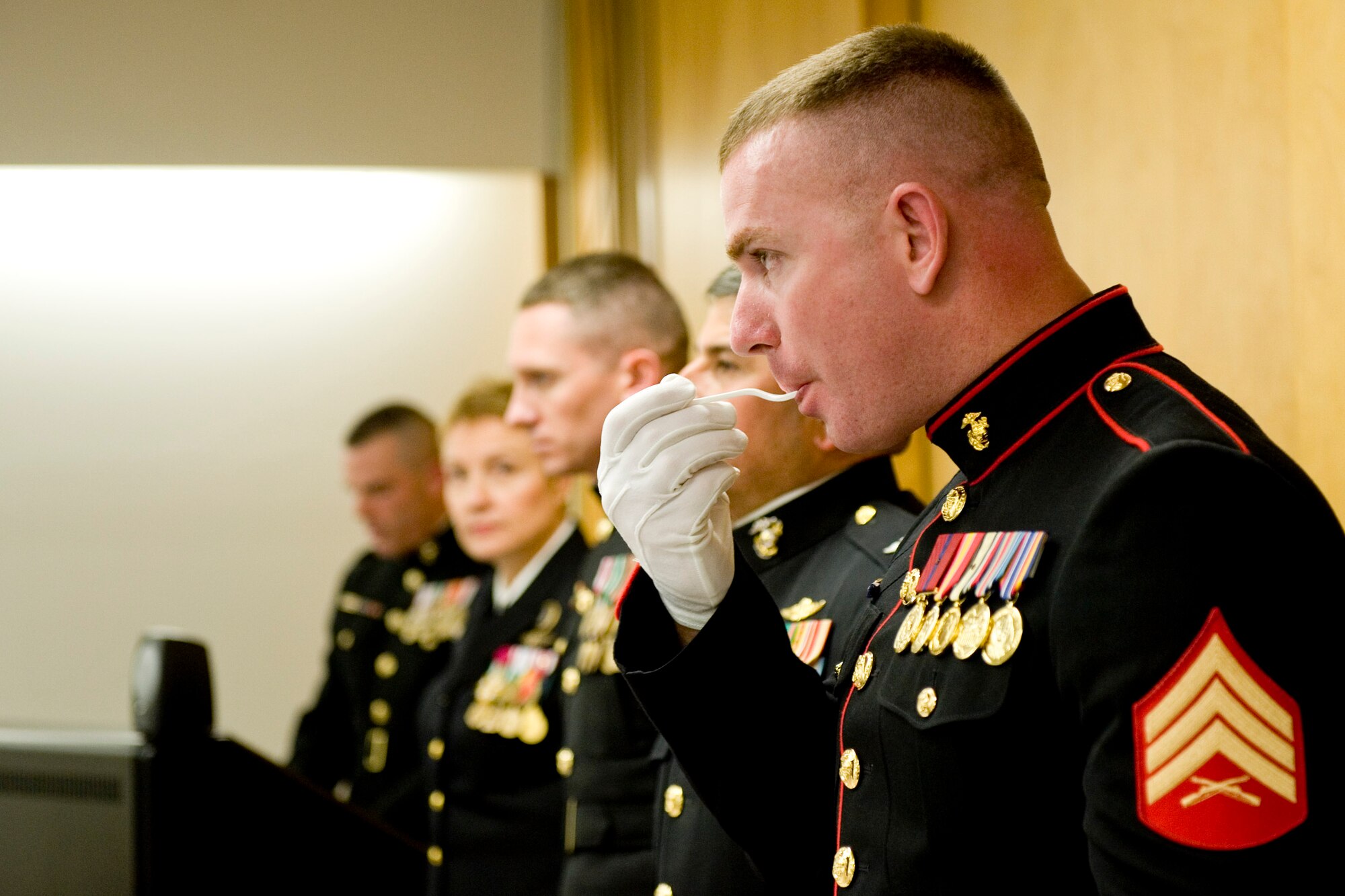 VANDENBERG AIR FORCE BASE, Calif. - Marine Corps Sgt. Christopher Pettingill, the youngest of four Marines assigned to the Joint Space Operations Center here, takes the ceremonial first-bite of the cake for the celebration of the 236th U.S. Marine Corps birthday Thursday, Nov. 10, 2011. Formed in 1775, the USMC has served in every American armed conflict and has the unique ability to rapidly deploy a combined-arms task force to almost anywhere in the world within days. (U.S. Air Force photo/Staff Sgt. Levi Riendeau)
