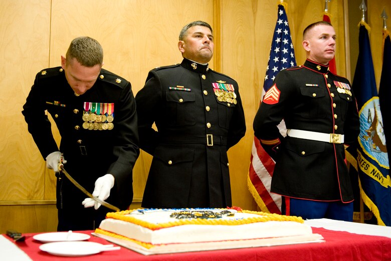 VANDENBERG AIR FORCE BASE, Calif. - Marine Corps Maj. Adrian Armold, one of four Marines assigned to the Joint Space Operations Center here, cuts the cake for the celebration of the 236th U.S. Marine Corps birthday Thursday, Nov. 10, 2011. Formed in 1775, the USMC has served in every American armed conflict and has the unique ability to rapidly deploy a combined-arms task force to almost anywhere in the world within days. (U.S. Air Force photo/Staff Sgt. Levi Riendeau)
