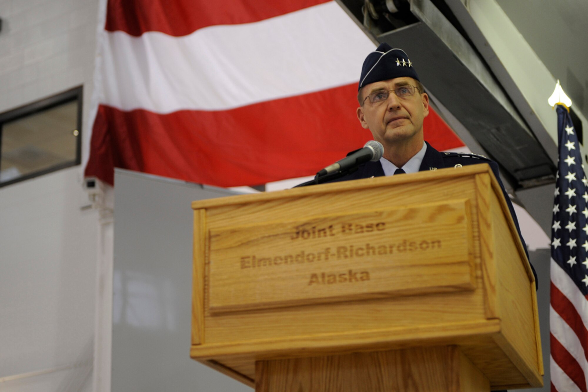 Lt. Gen. Stephen Hoog addresses his new command for the first time during the Alaskan Command, Eleventh Air Force, Alaskan North American Aerospace Defense Command Region, and Joint Task Force Alaska change of command ceremony held Nov. 7, 2011 at Joint Base Elmendorf-Richardson, Alaska. Admiral Robert Willard, Pacific Command commander, officiated the ceremony. (U.S. Air Force photo/Steve White)