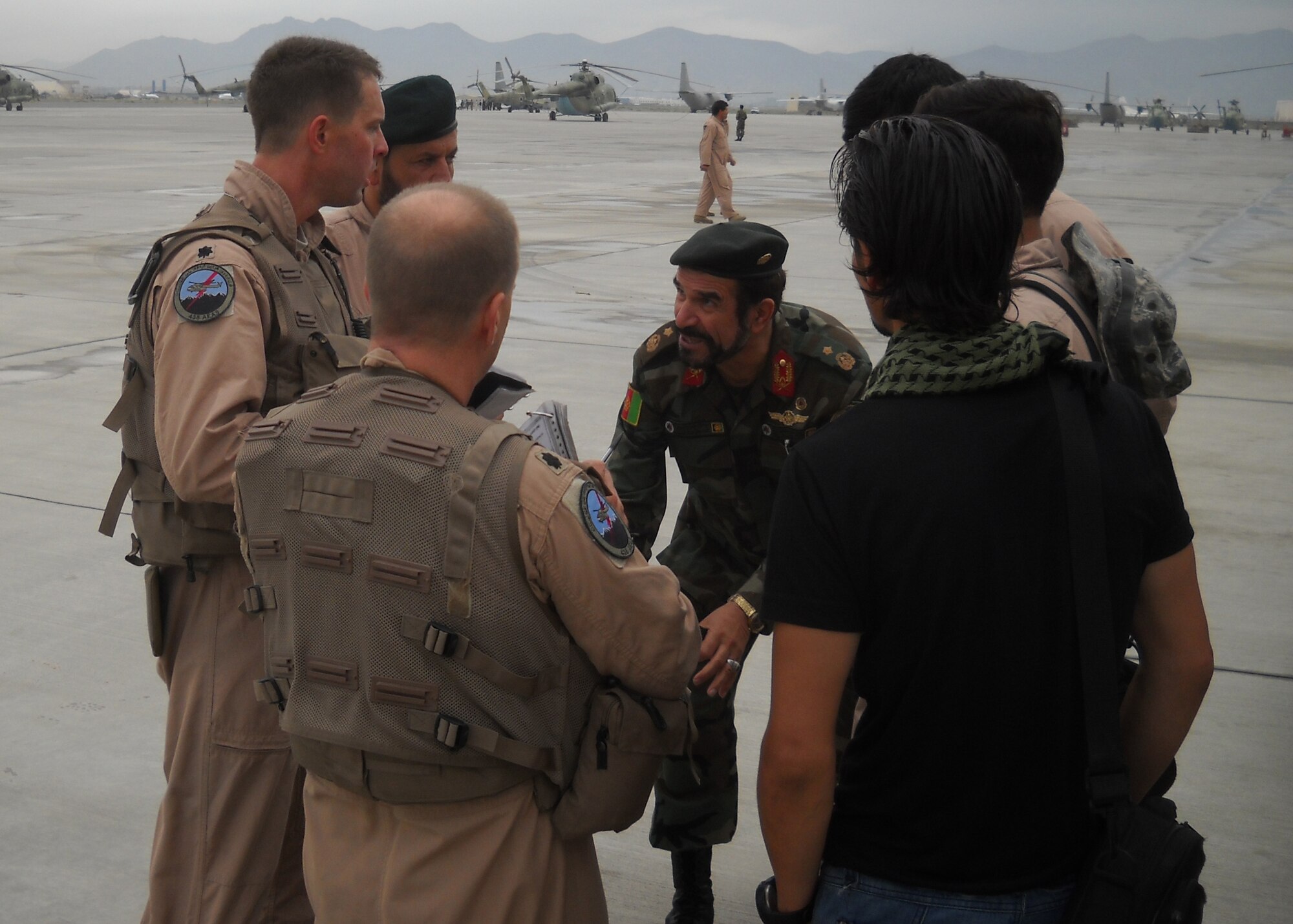 Lt. Col. Greg Roberts, 19th Air Force, briefs an Afghan Air Force crew before departing on a rescue mission which leads to the saving of more than 2,000 people over two days. Roberts received the Distinguished Flying Cross with valor for his actions during the rescue in Afghanistan July 28-29, 2010. (Courtesy photo)