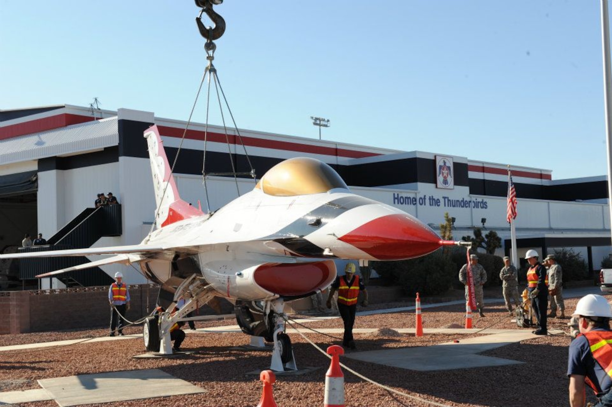 The Thunderbirds F-16C static display, tail number 87-0323, is placed on display outside the Thunderbird hangar on Oct. 31, 2011 at Nellis Air Force Base, Nev. The Thunderbirds transitioned from the F-16A/B in 1991 to the F-16C/D for the 1992 show season. (U.S. Air Force photo/Staff Sgt Richard W. Rose Jr.)
