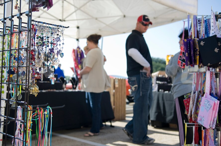 Members of Team Barksdale browse shopping stands during the Fall Festival on Barksdale Air Force Base, La., Nov. 5. Local businesses participated in the Fall Festival as a way to show their support to Barksdale Airmen and their families. (U.S. Air Force photo/Airman 1st Class Benjamin Gonsier)(RELEASED)