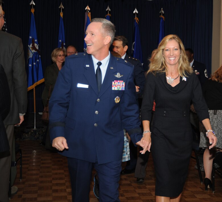 Making his move to Texas in a blaze of glory, Brigadier General William “Blaze” Binger is now the Air Force Reserve Command’s Tenth Air Force commander. His wife, Maureen, walks down the aisle alongside after the ceremony that took place at the Naval Air Station Fort Worth Joint Reserve Base, Texas. Binger assumed command from Maj. Gen. Frank J. Padilla after two and a half years at 10th AF on Nov. 5.