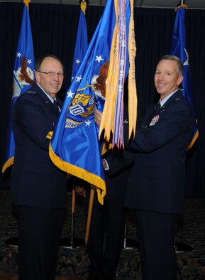 Lt. Gen. Charles Stenner, Jr., Chief of Air Force Reserve, Headquarters U.S. Air Force, Washington, D.C., and Commander, Air Force Reserve Command, Robins Air Force Base, Ga., passes the guidon to Brig Gen William Binger as he transfers command of Tenth Air Force located at the Naval Air Station Fort Worth Joint Reserve Base, Texas. Binger assumed command from Maj. Gen. Frank J. Padilla after two and a half years at 10th AF on Nov. 5.  