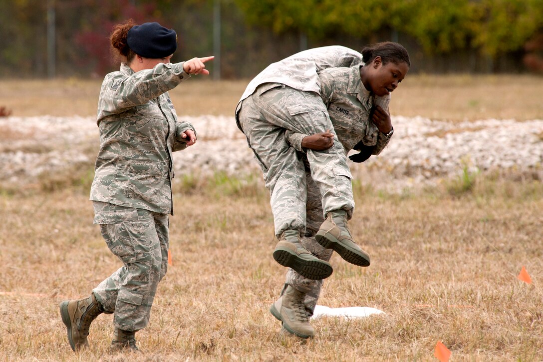 Airman 1st Class Nikili Carter, of the 307th Security Forces Squadron, uses the fireman carry technique on a teammate during the mental and physical competition during Global Strike Challenge 2011 at Barksdale Air Force Base, La., Nov. 7, 2011. Teams competing in the event were not allowed to know the details of the competition, which included grueling physical and logic scenarios. (U.S. Air Force photo/Master Sgt. Greg Steele)



