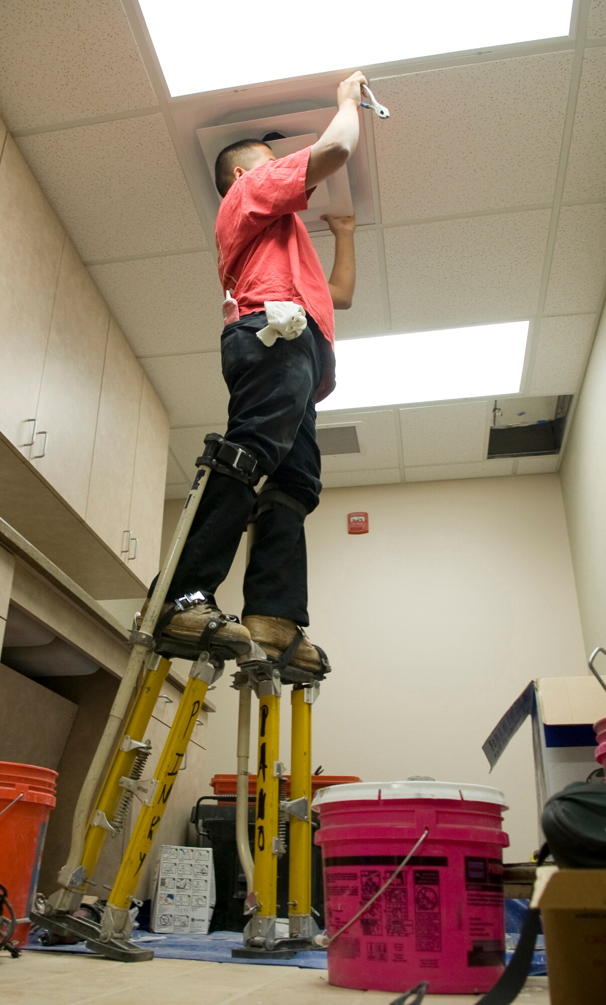 Lisandro Piedra, a contracted worker, puts a tile in place during construction in the new command post on Barksdale Air Force Base, La., Nov. 10. The new command post is scheduled to open by the end of this year. (U.S. Air Force photo/Airman 1st Class Benjamin Gonsier)(RELEASED)