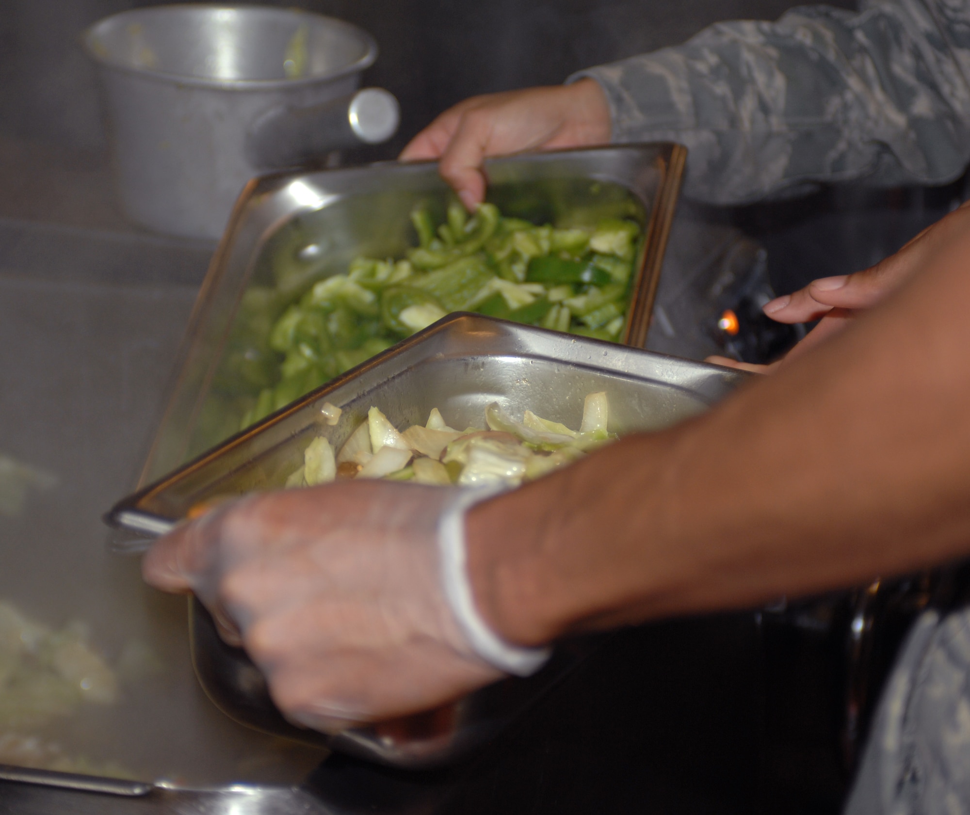 U.S. Air Force Airmen with the 355th Force Support Squadron prepare vegetables for the upcoming lunch hour at the dining facility here at Davis-Monthan Air Force Base, Ariz. Nov. 9. (U.S. Air Force photo by Airman 1st Class Michael Washburn/Released) 