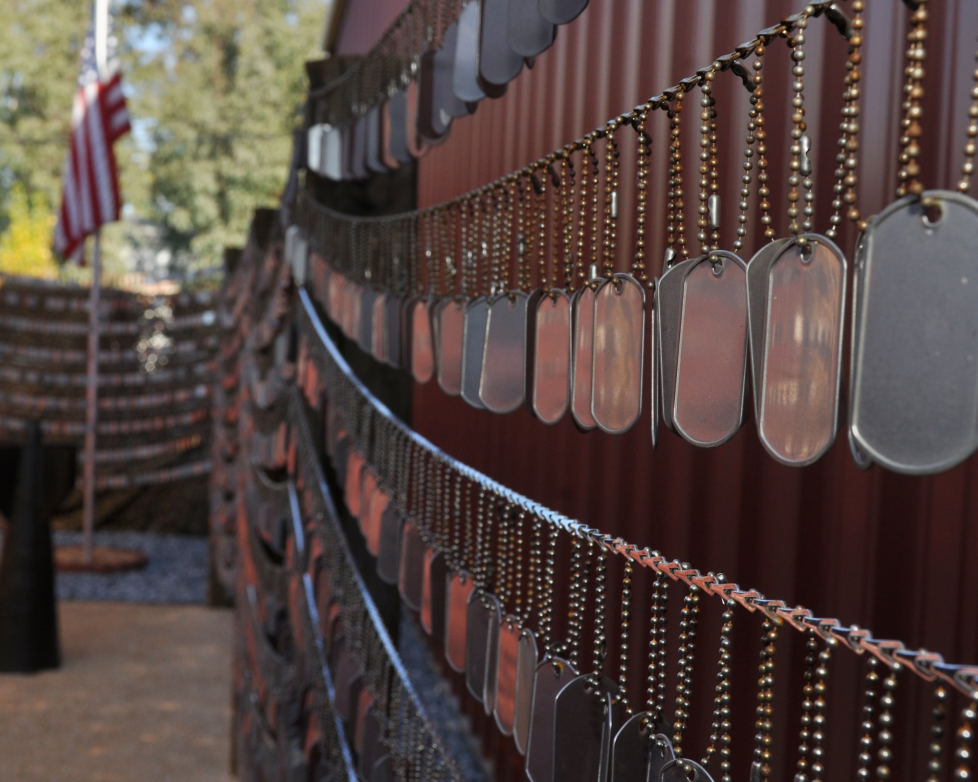 Dogs tags hang from the Iraq/Afghanistan Dog Tag Memorial at the Museum of the Forgotten Warrior outside of Beale Air Force Base, Calif., Nov. 10, 2011.  The memorial was built to honor all of the men and women who have been killed during the Iraq and Afghanistan Wars as of October 30, 2011, containing 6296 individual dog tags.  (U.S. Air Force photo by Staff Sgt. Jonathan Fowler)
