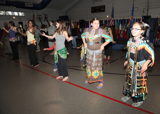 Bryanne Rainbow and Nelenah Greyes participate in belly dancing at the Multicultural World Showcase on Nov. 9 on Grand Forks Air Force Base, N.D.  Members of the Grand Forks military community gathered to celebrate their diversity with educational booths, dance and music demonstrations and food from around the world.  (U.S. Air Force photo by Airman 1st Class Ashley N. Taylor)