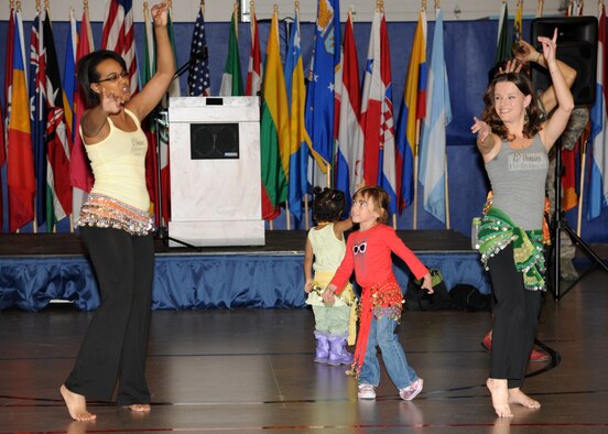 Children belly dance with Natasha Thomas and Jenna Solem, employees of The Twelve Houses, at the Multicultural World Showcase on Nov. 9 on Grand Forks Air Force Base, N.D.  Members of the Grand Forks military community gathered to celebrate their diversity with educational booths, dance and music demonstrations and food from around the world.  (U.S. Air Force photo by Airman 1st Class Ashley N. Taylor)