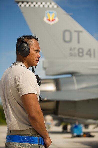 U.S. Air Force Staff Sgt. Leo Oliphant, assigned to the 46th Aircraft Maintenance Squadron (AMXS) as a crew chief, gives the signal to an F-16 Fighting Falcon pilot to hold breaks prior to a training flight in support of Exercise Vigilant Shield 12 at Naval Air Station Key West, Fla., Nov. 6, 2011. The exercise in Key West is the "first-ever proof of concept" for the military's Joint Deployable Integrated Air and Missile Defense System, a collection of high-end radars and missile systems as well as aircraft that work in tandem in the event of a threat to the continental United States.  The 46th AMXS is from Eglin Air Force Base, Fla.  (U.S. Air Force photo by Staff Sgt. Kamaile O. Long/Released)