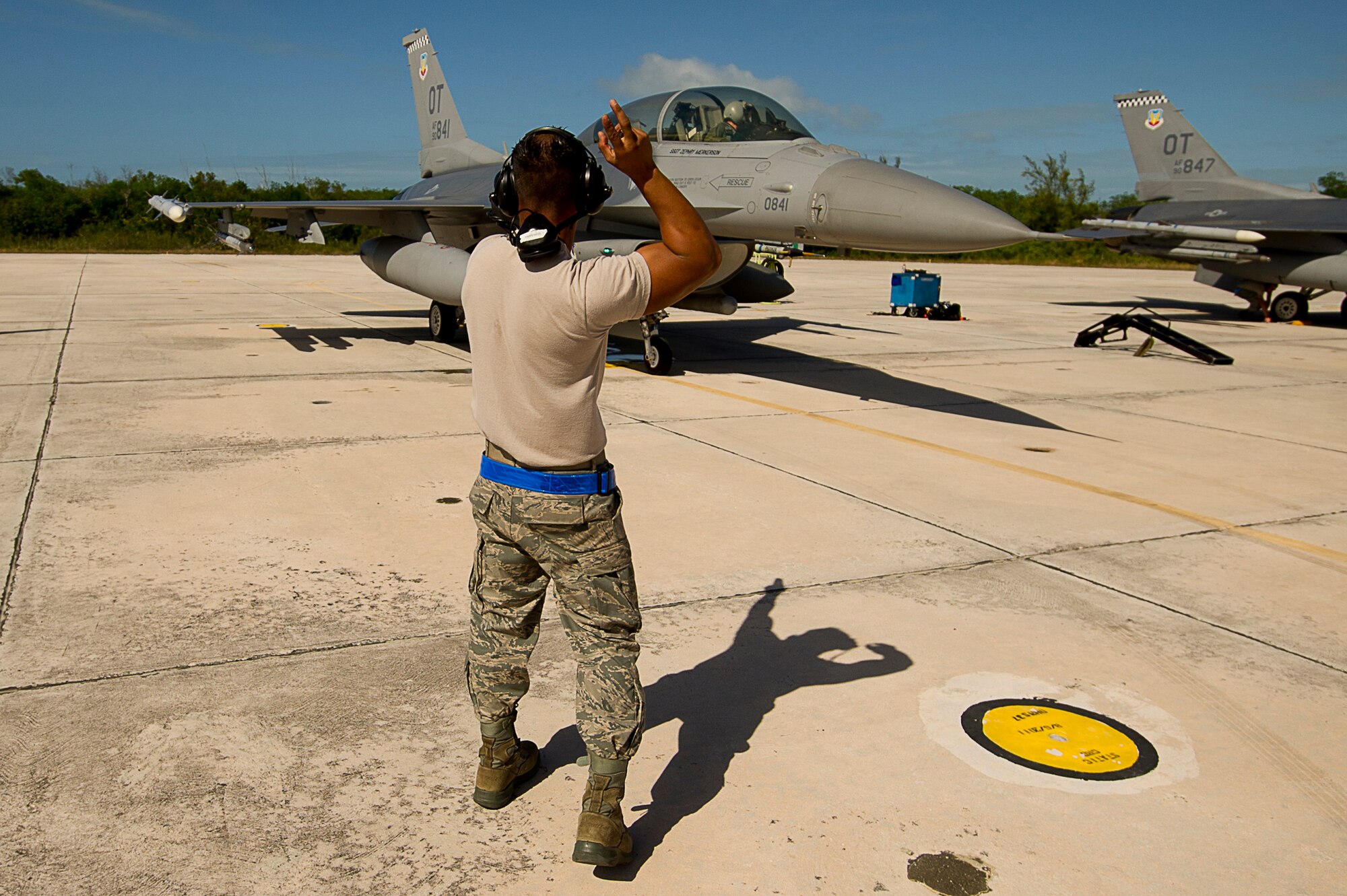 U.S. Air Force Staff Sgt. Jam Baro, crew chief, from the 46th Aircraft Maintenance Squadron, blue aircraft maintenance unit, Eglin Air Force Base, Fla., prepares a F-16 Fighting Falcon for a mission during exercise Vigilant Shield 12 on Naval Air Station Key West, Fla., Nov. 6, 2011. The exercise in Key West will be the "first-ever proof of concept" for the military's Joint Deployable Integrated Air and Missile Defense System, a collection of high-end radars and missile systems as well as aircraft that work in tandem in the event of a threat to the continental United States.  (U.S. Air Force photo by Tech. Sgt. Dennis J. Henry Jr.)