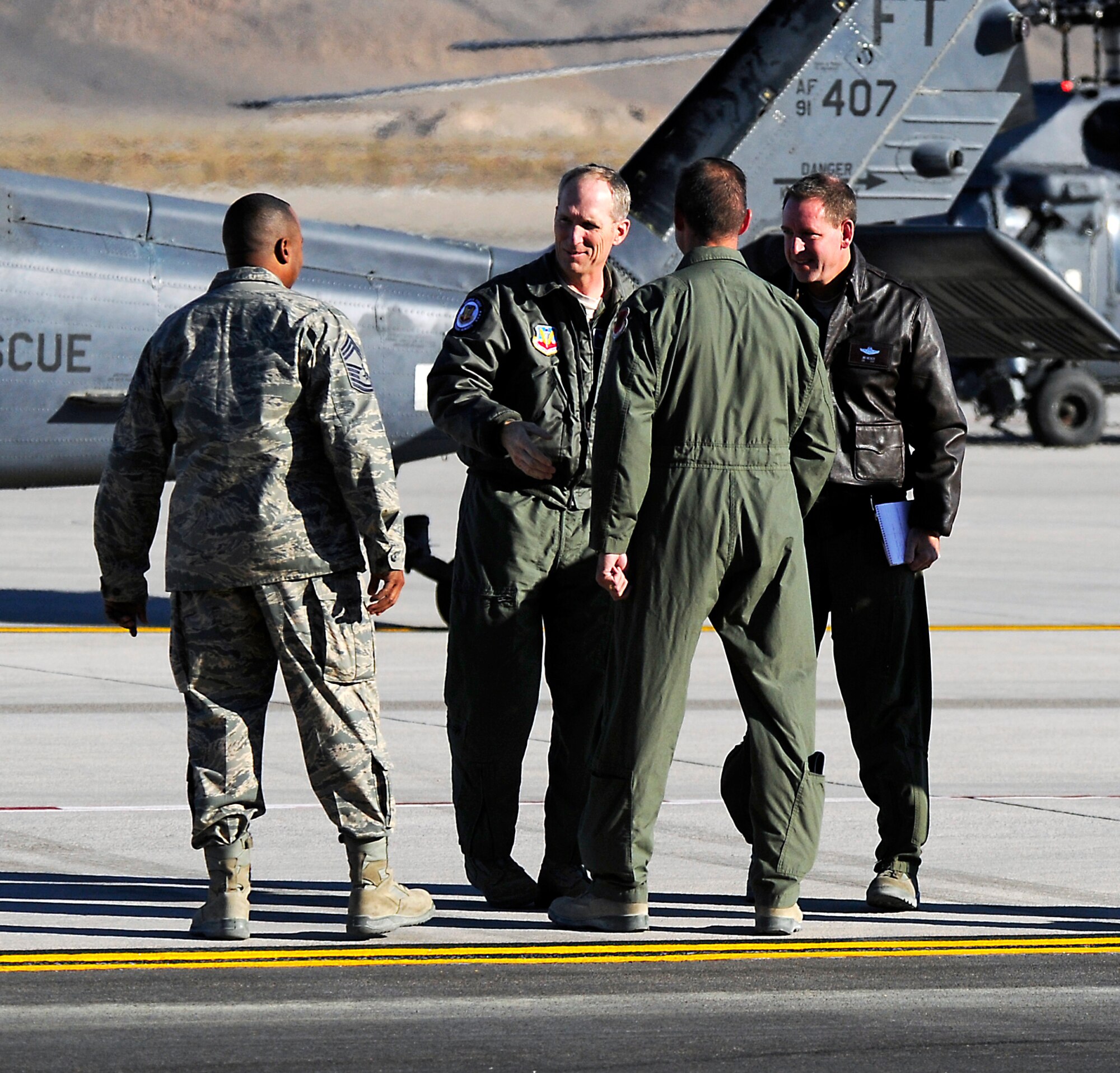 U.S. Air Force Gen. Mike Hostage, commander of Air Combat Command, introduces himself on the flightline at Creech Air Force Base, Nev., Nov. 9, to 432nd Wing/432 Air Expeditionary Wing leadership. Hostage met with wing leadership and Airmen to tour the base and provide direction as the new ACC commander. (U.S. Air Force photo by 432nd AEW Public Affairs/Released).
