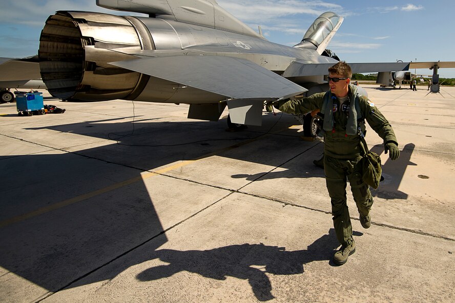 U.S. Air Force Maj. James Geoppinger  completes his preflight check of a F-16 Fighting Falcon for a mission during exercise Vigilant Shield 12 on Naval Air Station Key West, Fla., Nov. 6, 2011. The exercise in Key West will be the "first-ever proof of concept" for the military's Joint Deployable Integrated Air and Missile Defense System, a collection of high-end radars and missile systems as well as aircraft that work in tandem in the event of a threat to the continental United States.  (U.S. Air Force photo by Tech. Sgt. Dennis J. Henry Jr.)