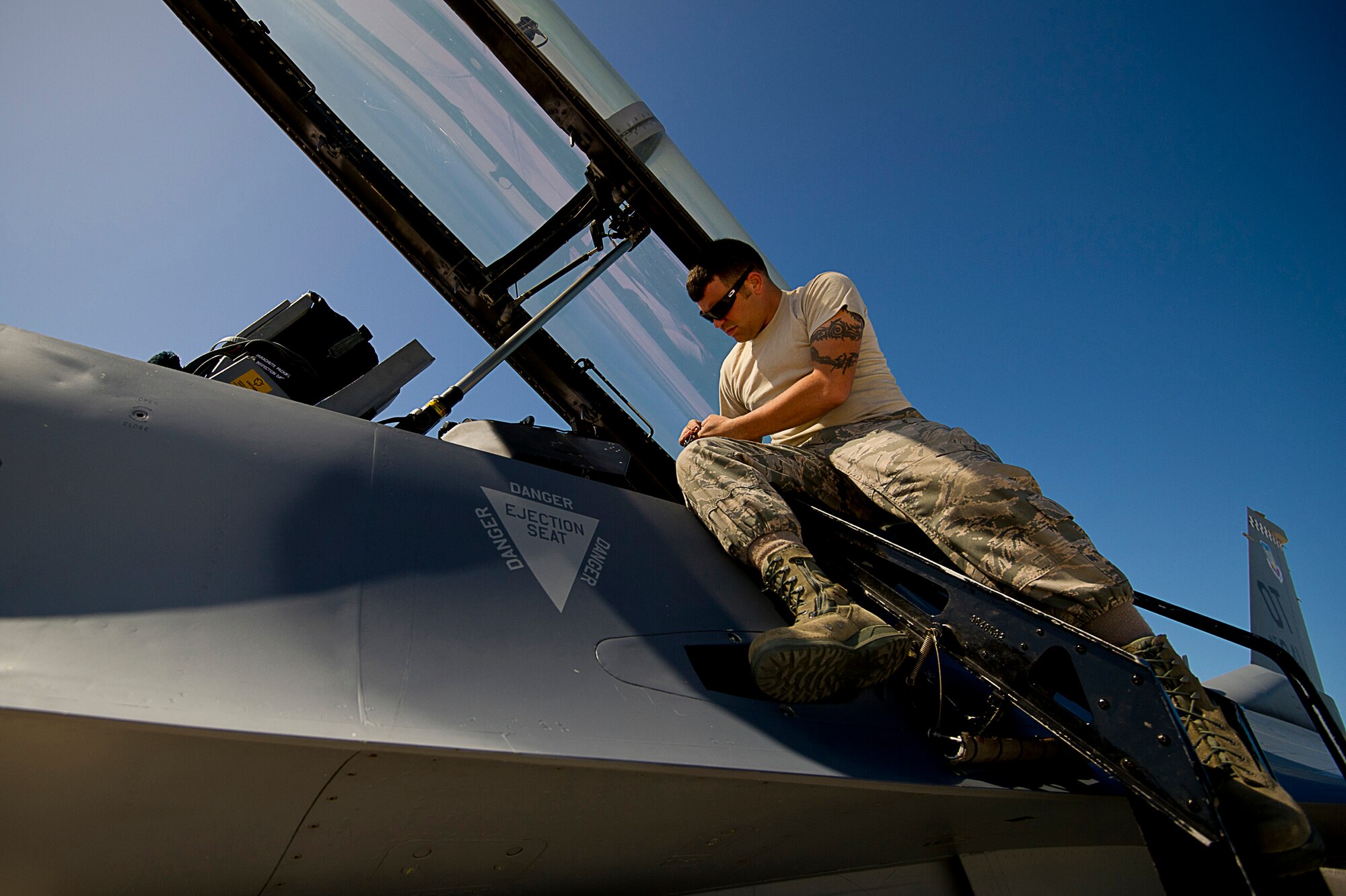 U.S. Air Force Senior Airman Jon Peek, crew chief, from the 46th Aircraft Maintenance Squadron, blue aircraft maintenance unit, Eglin Air Force Base, Fla., prepares a F-16 Fighting Falcon for a mission during exercise Vigilant Shield 12 on Naval Air Station Key West, Fla., Nov. 6, 2011. The exercise in Key West will be the "first-ever proof of concept" for the military's Joint Deployable Integrated Air and Missile Defense System, a collection of high-end radars and missile systems as well as aircraft that work in tandem in the event of a threat to the continental United States.  (U.S. Air Force photo by Tech. Sgt. Dennis J. Henry Jr.)