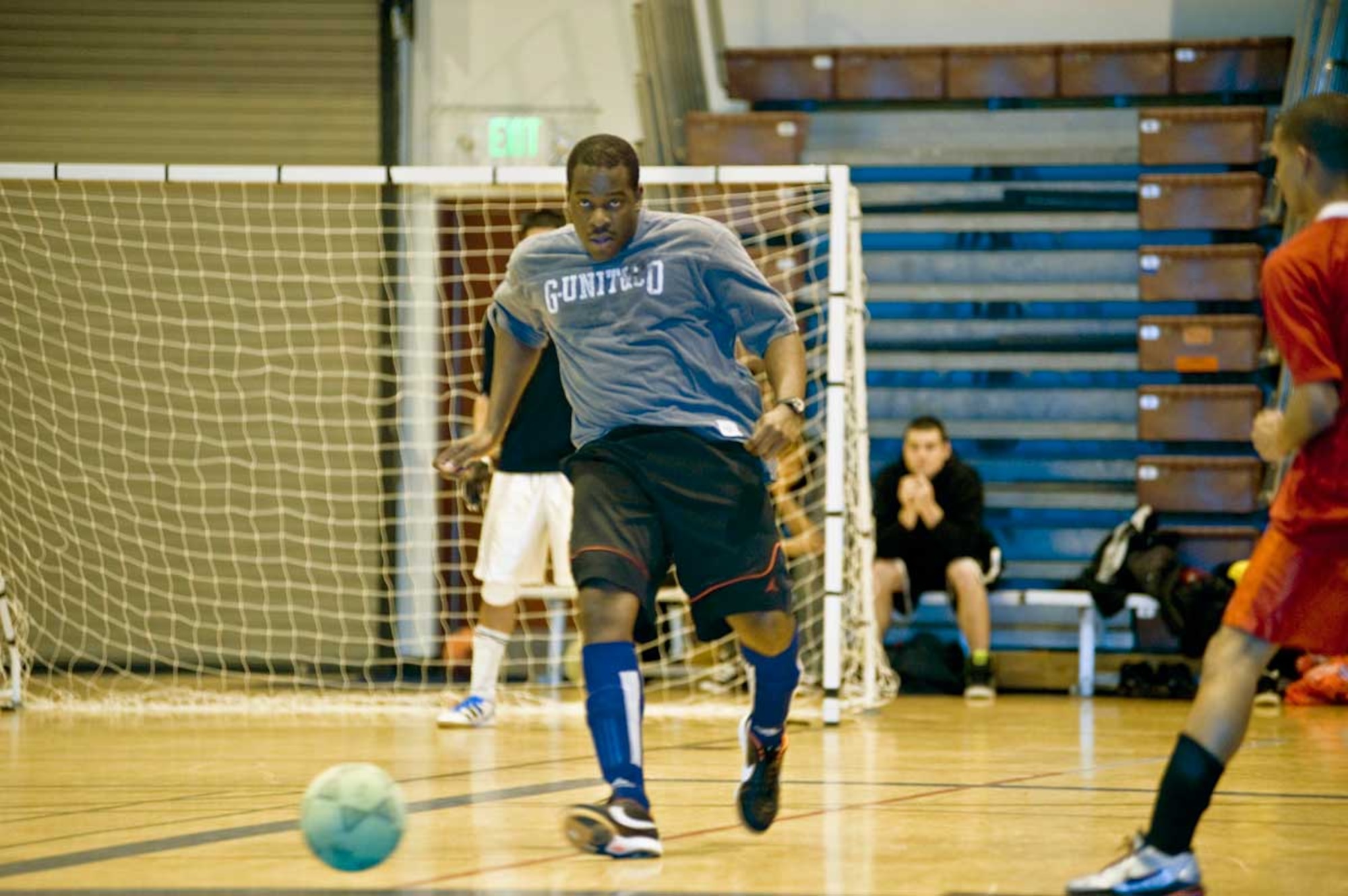 Dwayne Salmon, 673d Medical Group, dribbles the ball away from his team’s goal during soccer playoffs.  The 673rd Medical Group tied the 56th Engineer Company, 6-6, in the competition for the upcoming soccer finals. (U.S. Air Force photo/Staff Sgt. Robert Barnett)