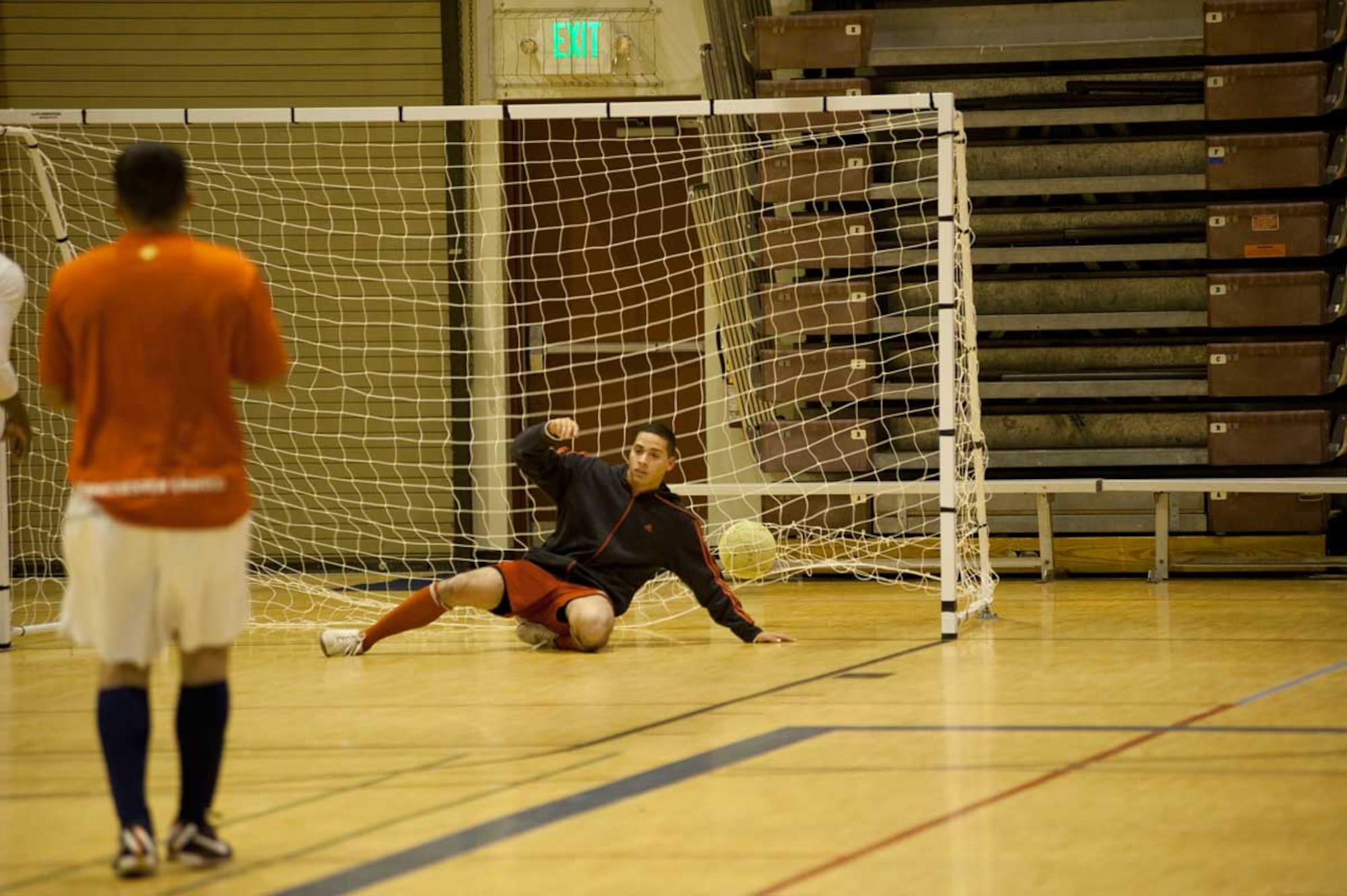 The 95th Chemical Company team scores a goal against the 725th Support Battalion during a soccer game at the Buckner Physical Fitness Center Monday night. The 95th beat the 725th 12-5. (U.S. Air Force photo/Staff Sgt. Robert Barnett)