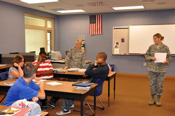 HUBBARD HIGH SCHOOL, Ohio -- Air Force Staff Sgt. Kalee Lint, 910th Airlift Wing Non-Commissioned Officer in Charge (NCOIC) of Development and Training, and Air Force Reserve Tech. Sgt. Kathy Whitaker, a personnel technician, assigned to the 910th Force Support Squadron, conduct an ethics training class for a group of students here, Nov. 10, 2011. The Citizen Airmen, based at nearby Youngstown Air Reserve Station, Ohio, were demonstrating how the high school students can use ethics, the standards that help determine what is good, right and proper, in their day-to-day lives as part of "Excellence through Ethics Day," a program by Junior Achievement of Mahoning Valley, a civic organization with the goal of empowering young people to own their economic success. U.S. Air Force photo by Master Sgt. Bob Barko Jr