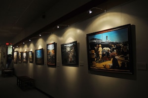 Displays of paintings depict the many types of cargo shipping the Army has employed throughout the decades. (U.S. Air Force photo by Staff Sgt. Ashley Hawkins/Released)