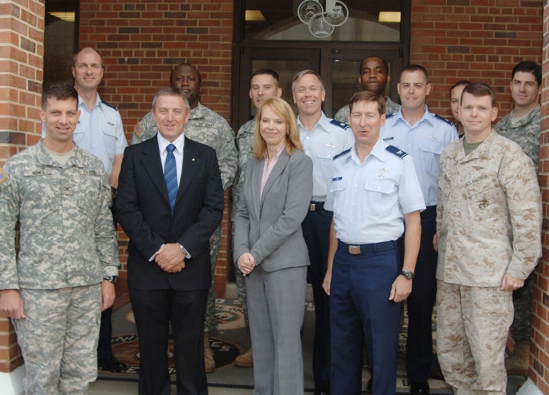 Members of the Air Land Sea Application Center, located on Langley Air Force Base, pose with doctrine writers from the Australian Joint Warfare Doctrine and Training Centre at ALSA Oct. 31. Pictured on the front row from left are: Army Col. Bruce Sones (deputy director), Chris Ross and Vanessa Kovalevs, Australian doctrine writers, Air Force Col. David Hume (director) and Marine Corps Maj. Jeffrey Hughes. Pictured on the back row from left are: Air Force Maj. Clayton Laughlin, Army Lt. Col. Stephen Parker, Army Lt. Col. Dana Smith, Air Force Lt. Col. Michael Woltman, Army Lt. Col. Troy Ewing, Air Force Lt. Col. Andrew Frasch, Navy Cdr. Cynthia Dieterly and Army Maj. Michael Saxon. (Photo courtesy/Pat Radcliffe)