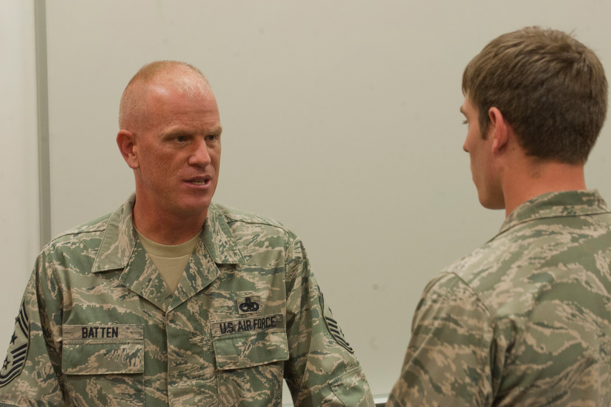 U.S. Air Force Chief Master Sgt. Frank Batten, 23rd Wing command chief, Moody Air Force Base, Ga., speaks with a cadet during the question and answer portion of a tour for Moody members at the U.S. Air Force Academy, Colorado Springs, Colo., Nov. 4, 2011. Batten and fellow Moody members went to the academy to interact with 23rd Wing's sponsored squadron, Cadet Squadron 9, but opened the question and answer session up to all cadets in the academy. Batten brought an enlisted perspective to the future leaders of the operational Air Force. (U.S. Air Force Photo by Staff Sgt. Joshua J. Garcia/Released)