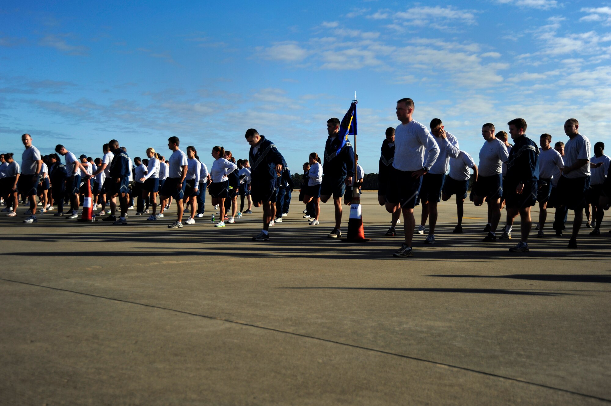 U.S. Air Force Airmen stretch prior to the 5 km run, Hurlburt Field, Fla., Nov. 7, 2011.  Air Force Special Operations Command Airmen ran in a single formation to support morale and unity. (U.S. Air Force photo/Airman 1st Class Naomi Griego)(Released)