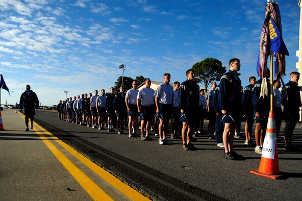 U.S. Air Force Airmen stand in formation prior to running 5 kilometers, Hurlburt Field, Fla., Nov. 7, 2011.  The base -wide 5-K run helped raise morale and created a sense of unity among Air Commandos. (U.S. Air Force photo/Airman 1st Class Naomi Griego)(Released)