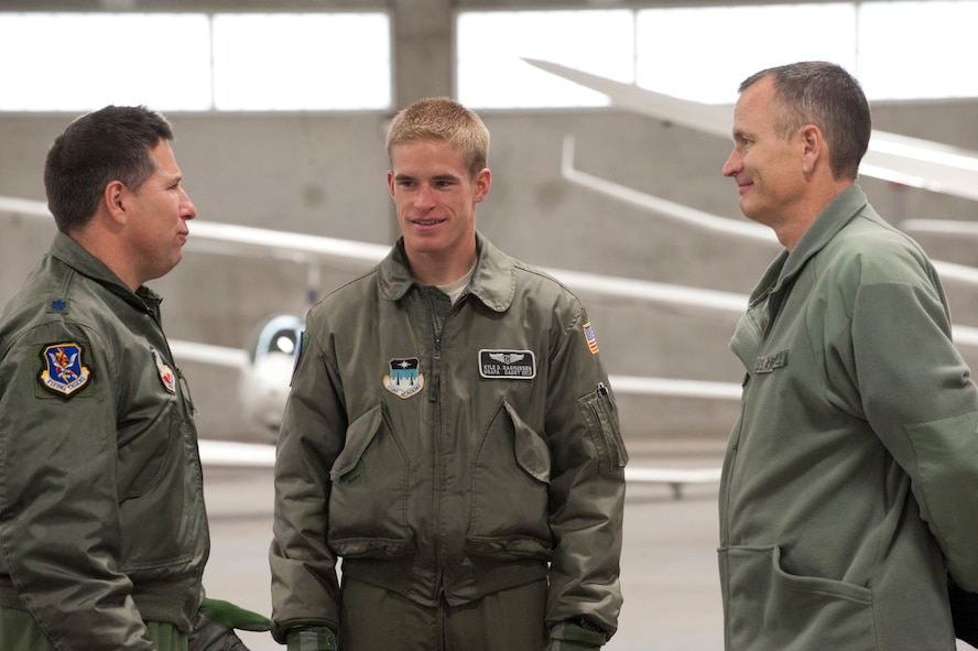 Cadet 2nd Class Kyle Rasmussen, U.S. Air Force Academy, center, speaks with Lt. Col. Patrick Boland, left, 23rd Wing director of staff, and U.S. Air Force Col. Billy Thompson, 23rd Wing commander both from Moody Air Force Base, Ga., during a tour of the U.S. Air Force Academy, Colorado Springs, Co., Nov. 4, 2011. During the tour Moody Airmen were able to interact with cadets and see some of the various opportunities that are available to the cadets during their college training.  (U.S. Air Force Photo by Staff Sgt. Joshua J. Garcia/Released)