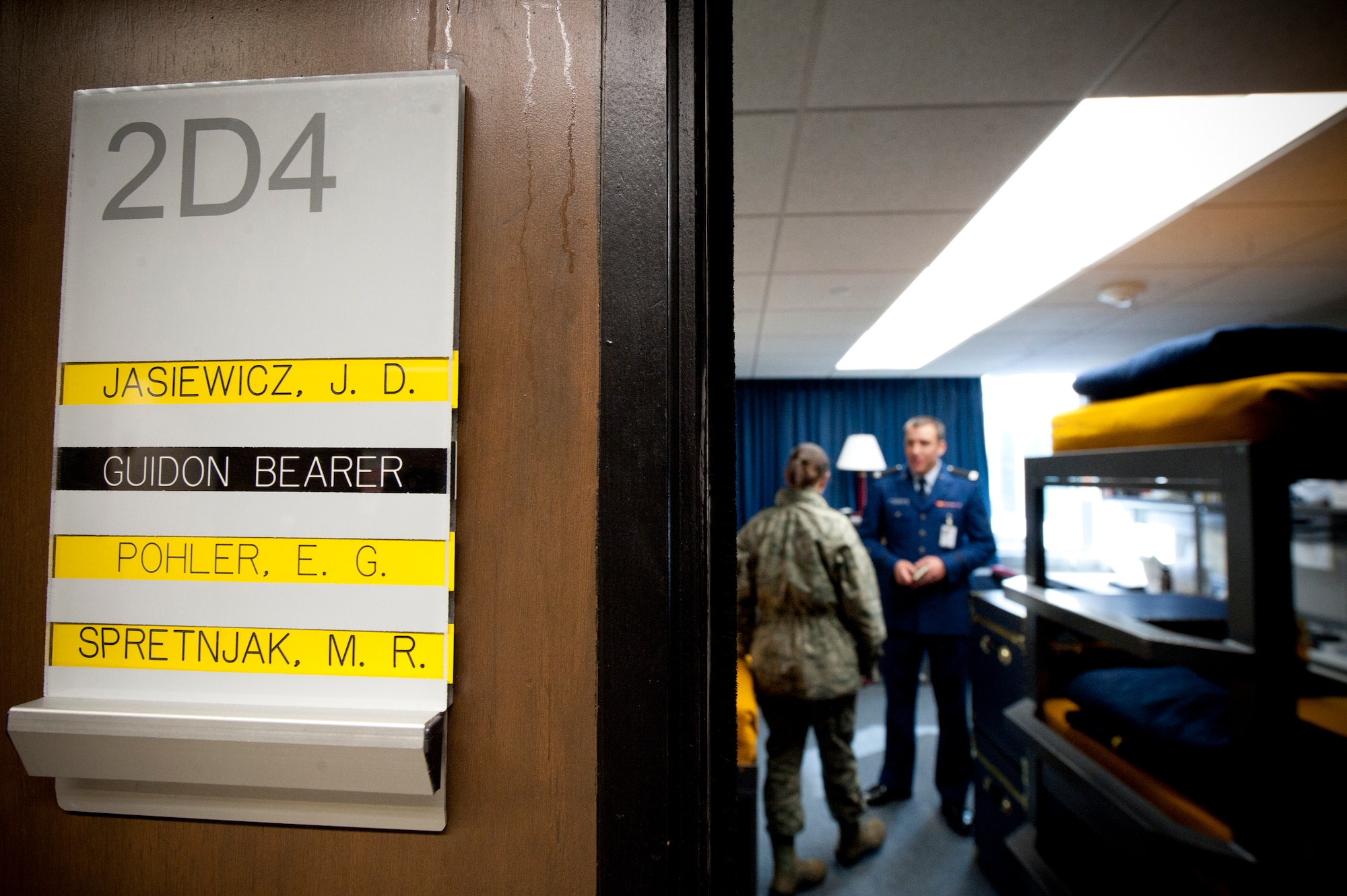 Cadet 4th Class Jacob Jasiewicz, Cadet Squadron 9, showcases his dorm room to a U.S. Air Force LtCol. Jackie Day, 23rd Medical Support Squadron, Moody Air Force Base, Ga., during a tour of the U.S. Air Force Academy, Colorado Springs, Colo., Nov. 4, 2011. The cadets interacted with Team Moody members from Nov. 3-7, where they gained knowledge on the operational Air Force and were able to show Moody members academy life. The cadets dorm rooms must remain in inspection order throughout the day and their doors stay open for on the spot inspections. (U.S. Air Force Photo by Staff Sgt. Joshua J. Garcia/Released)