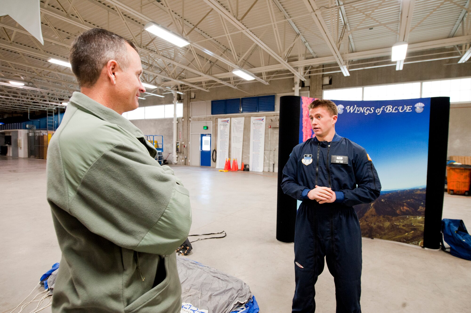 U.S. Air Force Cadet 2nd Class John Skeele, briefs U.S. Air Force Col. Billy Thompson, commander 23rd Wing Moody Air Force Base, Ga., on the Wings of Blue program at the U.S. Air Force Academy, Colo. Nov. 4, 2011. The Wings of Blue program is a cadet driven parachute program where upperclassmen instruct lowerclassmen on how to safely perform jumps. The Wings of Blue parachute team competes and perform nationally and internationally throughout the year.  (U.S. Air Force Photo by Staff Sgt. Joshua J. Garcia/Released)