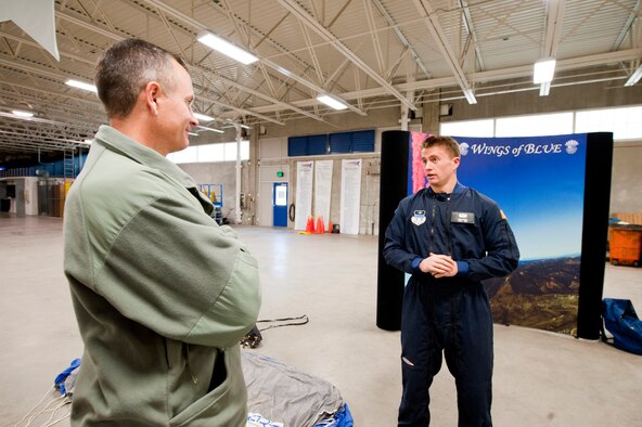 U.S. Air Force Cadet 2nd Class John Skeele, briefs U.S. Air Force Col. Billy Thompson, commander 23rd Wing Moody Air Force Base, Ga., on the Wings of Blue program at the U.S. Air Force Academy, Colo. Nov. 4, 2011. The Wings of Blue program is a cadet driven parachute program where upperclassmen instruct lowerclassmen on how to safely perform jumps. The Wings of Blue parachute team competes and perform nationally and internationally throughout the year.  (U.S. Air Force Photo by Staff Sgt. Joshua J. Garcia/Released)