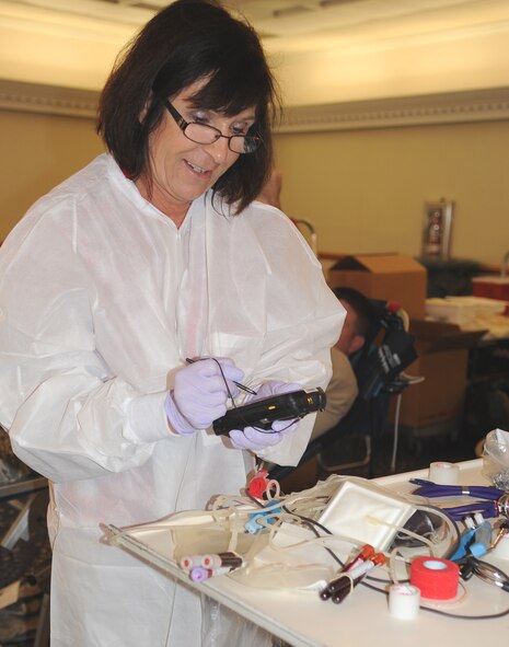 SEYMOUR JOHNSON AIR FORCE BASE, N.C. – Liz Miller, American Red Cross medical technician, documents and stores donated blood at Seymour Johnson Air Force Base, Nov. 10, 2011. The Red Cross is not a government agency; it relies on donations of time, money, and blood to operate. (U.S. Air Force photo by Senior Airman Gino Reyes)