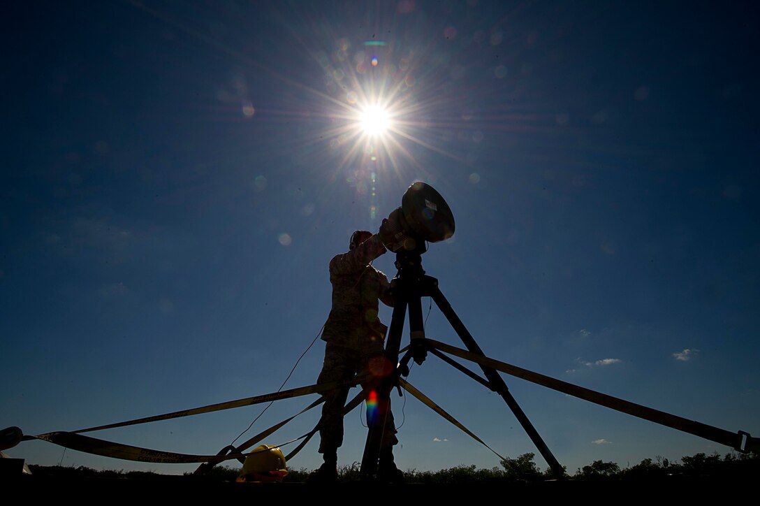 U.S. Air Force Senior Airman Horacio Maysonet from the 51st Combat Communications Squadron, Robins Air Force Base,  Ga., perform set up and testing on radio frequency modules (RFM) Naval Air Station (NAS) Key West, Fla., Nov. 5, 2011.  The RFM consolidates radar feeds extending long distances into one air picture allowing higher headquarters to access and engage incoming threats.  The exercise in Key West will be the "first-ever proof of concept" for the military's Joint Deployable Integrated Air and Missile Defense System, a collection of high-end radars and missile systems as well as aircraft that work in tandem in the event of a threat to the continental United States.  (U.S. Air Force photo by Tech. Sgt. Dennis J. Henry Jr./Released)
