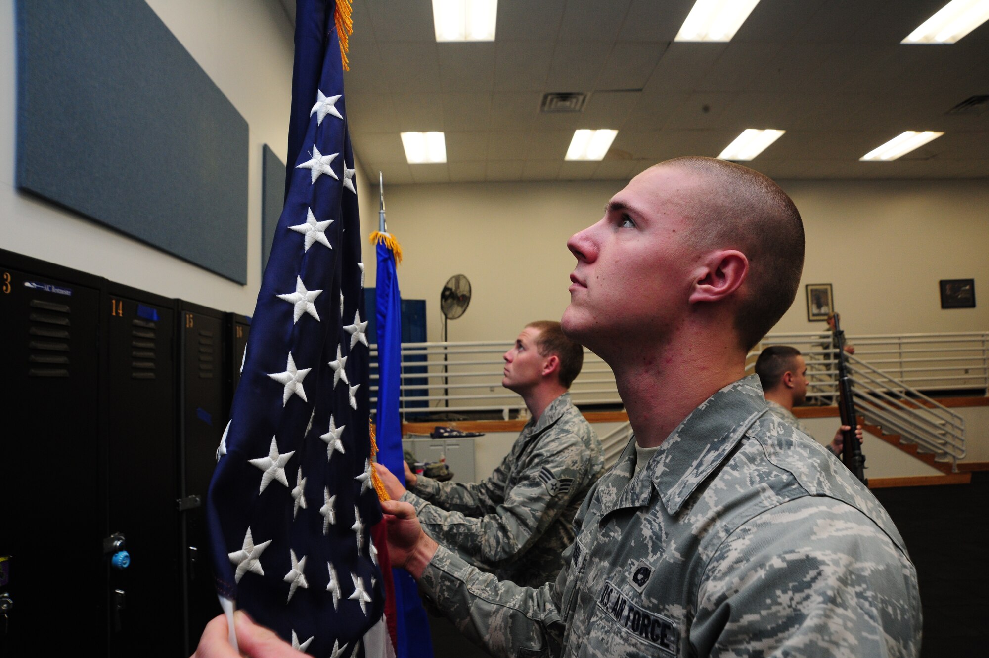 Fairchild Honor Guard members practice posting of the colors Oct. 28. The colors team primarily consists of the American flag, a military branch flag and two rifle guards. (U.S. Air Force photo/Airman 1st Class Taylor Curry)
