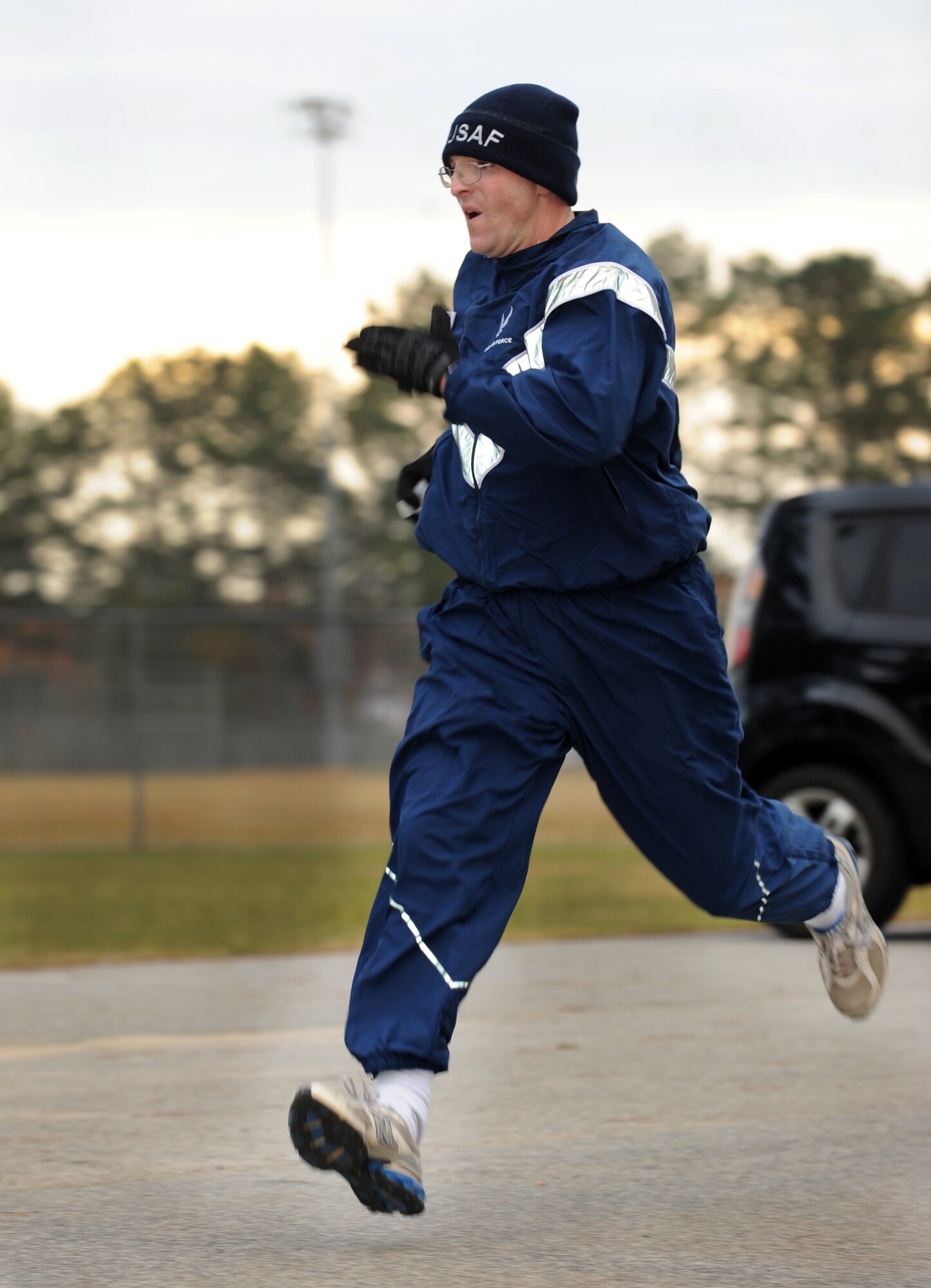 U.S. Air Force Tech. Sgt. William Ohrt, 20th Component Maintenance Squadron munitions mobility supervisor, nears the finish line during the 5K Combined Federal Campaign run, Shaw Air Force Base, S.C., Nov. 10, 2011.This year is "50 years of caring" for the CFC. CFC is an annual drive which is based on one idea for one gift, once a year. Its purpose is to "improve quality of local community, nation, and world," President John F. Kennedy 1961. This year's goal is to reach $175,000. (U.S. Air Force photo by Airman 1st Class Tabatha Duarte/Released)
