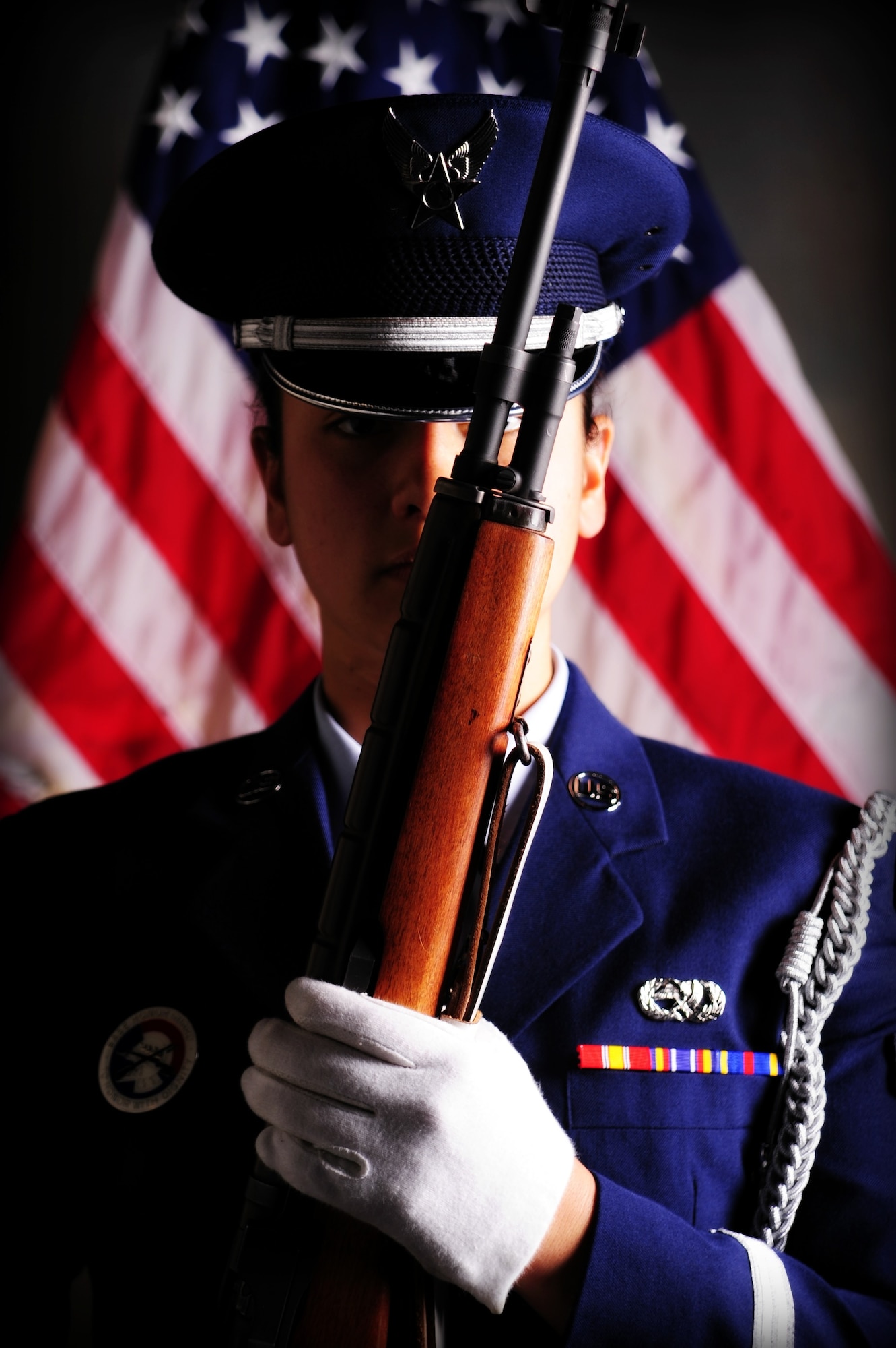 Airman 1st Class Carmella Kraus, Fairchild Honor Guard, poses at the position of port arms Oct. 28. The position of port arms is achieved by placing the top of the rifle at the left eye and the stock at your right eye. (U.S. Air Force photo/Airman 1st Class Taylor Curry)