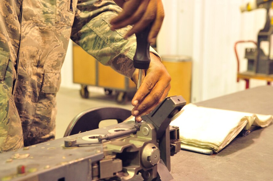 Staff Sgt. Douglas Parker prepares to remove a panel from an LAU- 128 rail launcher to conduct an inspection at the Armament shop on Seymour Johnson Air Force Base, N.C., Nov 9, 2011. A rail launcher facilitates the proper ejection of ammunition on an F-15E Strike Eagle. Every part of the physical weapons system of an F-15E Strike Eagle here is maintained at the 4th Equipment Maintenance Squadron armament shops. When repaired, the part is inspected by at least three people before it is cleared to go back on an aircraft. Parker is a 4 EMS aircraft armament systems specialist from Virginia Beach, Va. (U.S. Air Force photo by Senior Airman Marissa Tucker)
