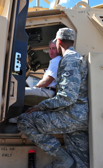 U.S. Air Force Staff Sgt. Cameron Riley, 820th Combat Operations Squadron NCO in charge of formal training explains to Joel Stansel, The Church of Jesus Christ of Latter Day Saints of Valdosta bishops counselor, how a mine resistant ambush protected vehicle operates in a deployed location during a local clergy members visit to Moody Air Force Base, Ga., Nov. 3, 2011. The chaplains on- base rely on the off- base clergy to help Airmen with spiritual needs in the event  all of the chaplains are not able to provide that assistance. (U.S. Air Force photo by Staff Sgt. Stephanie Mancha/Released)