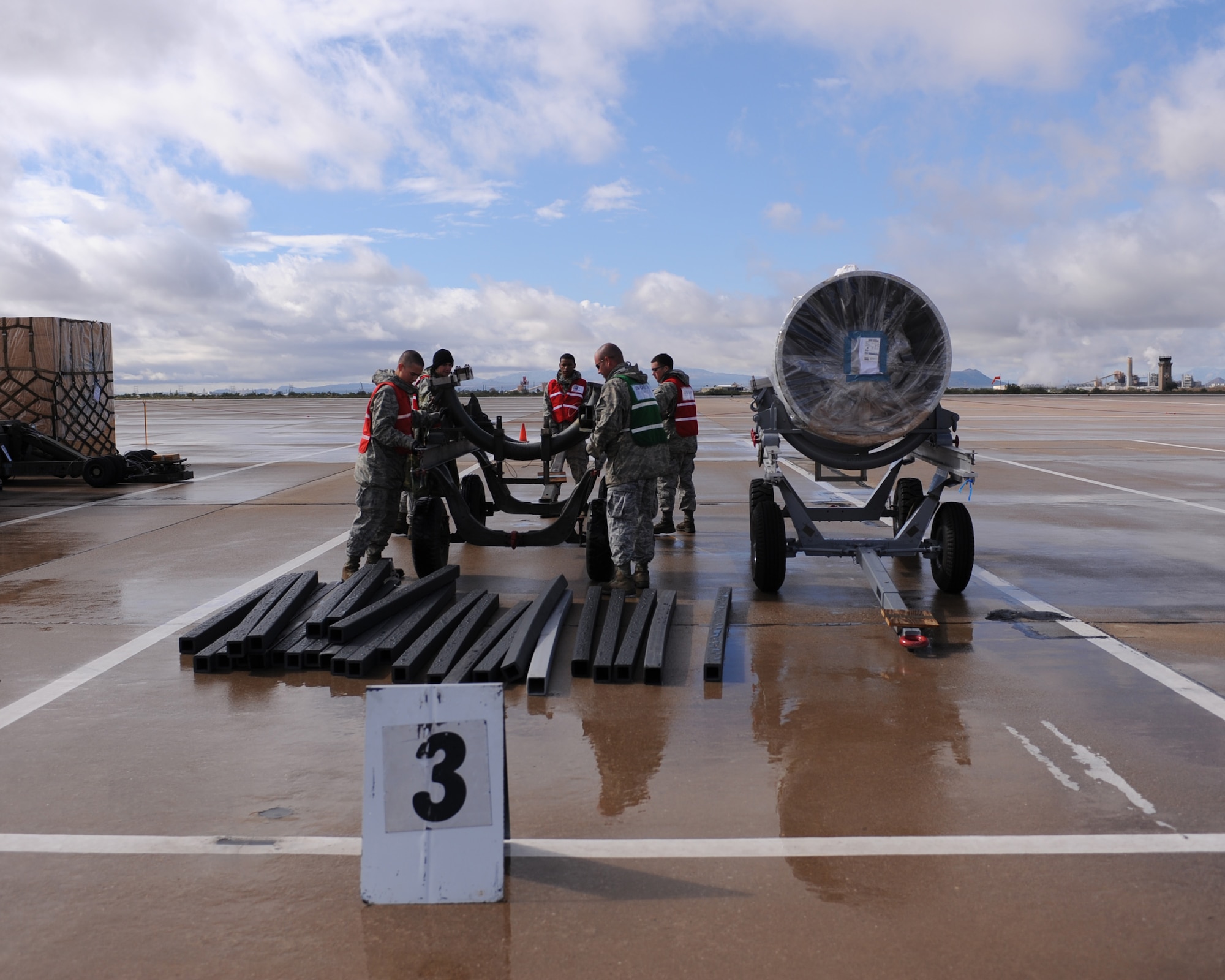 U.S. Air Force Airmen from the 355th Fighter Wing set a plane engine trailer during the operational readiness exercise on the flightline at Davis-Monthan Air Force Base, Ariz., Nov. 7, 2011. (U.S. Air Force photo by Airman 1st Class Christine Griffiths/Released)