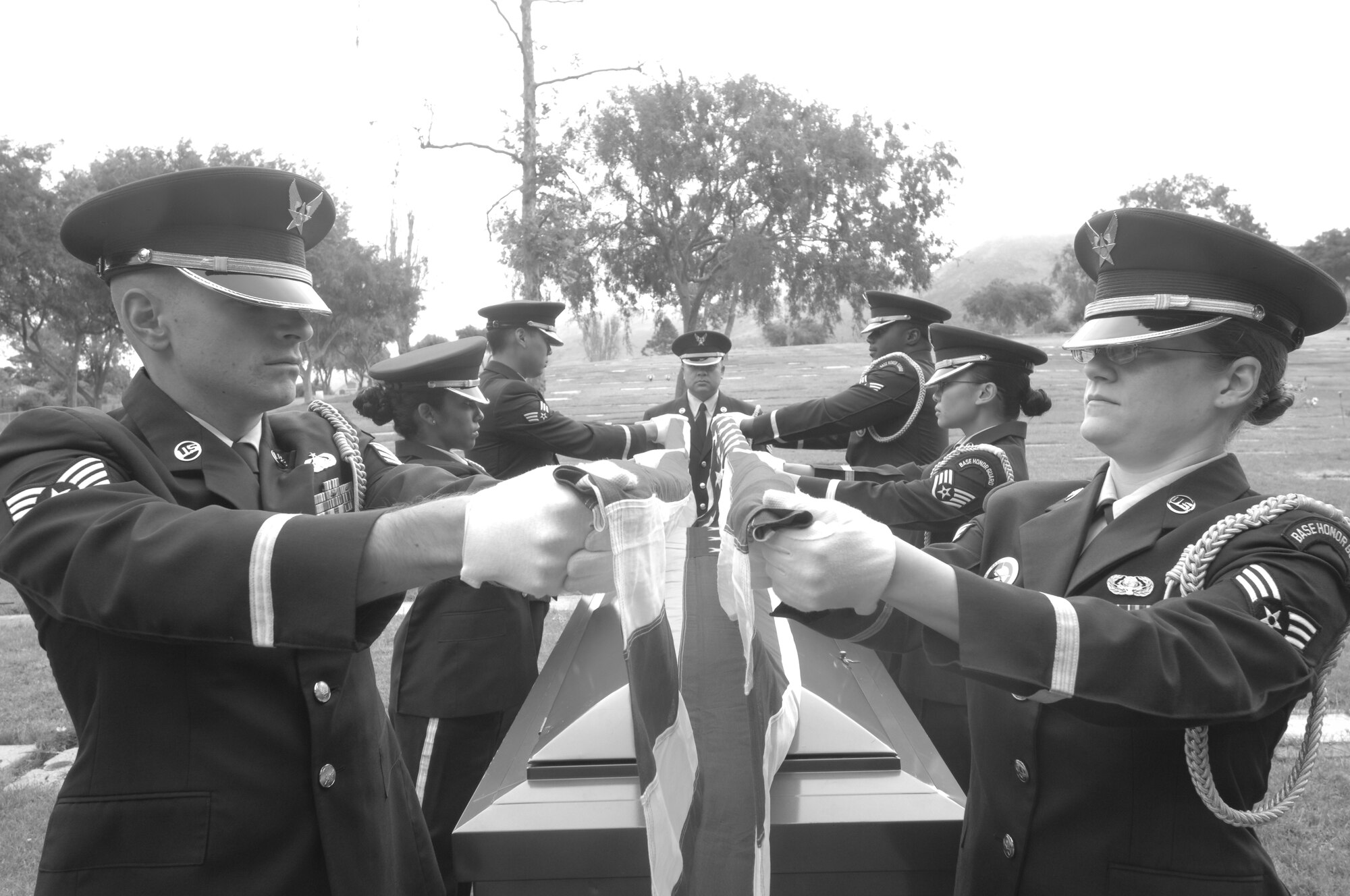 VANDENBERG AIR FORCE BASE, Calif.-- A 10-man base honor guard funeral detail folds the American flag during a funeral practice at the Lompoc Evergreen Cemetery here Tuesday, Sept. 20, 2011. The rendering of military funeral honors is a way to show the nation’s deep gratitude to those who, in times of war and peace, have faithfully defended the county.  (U.S. Air Force photo/Senior Airman Lael Huss)
