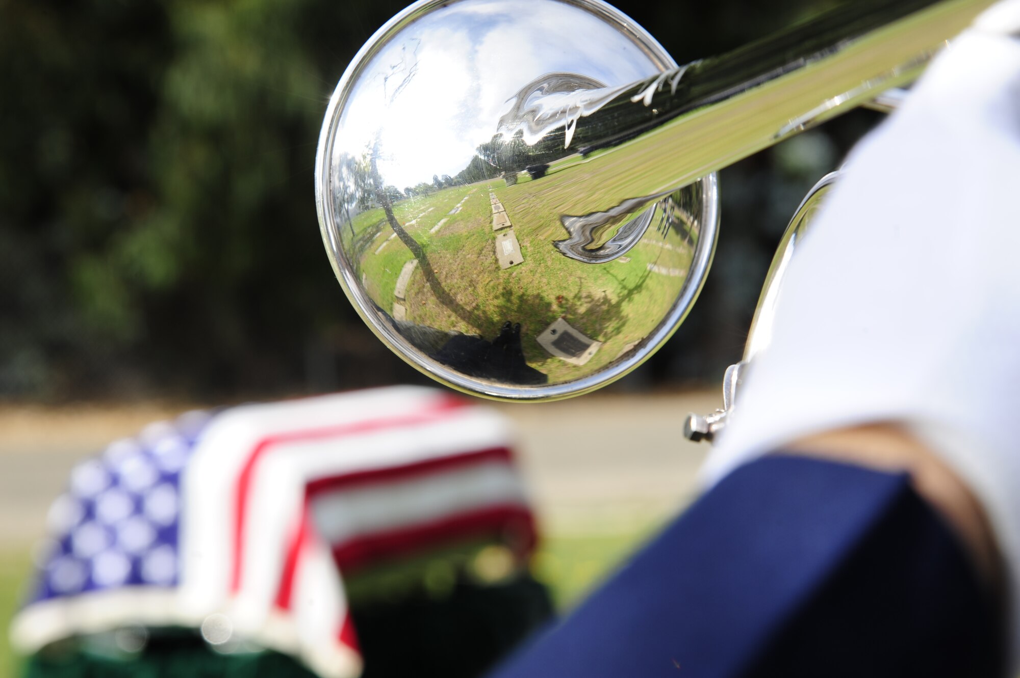 VANDENBERG AIR FORCE BASE, Calif.-- A bugle player with the base honor guard plays taps during a funeral practice at the Lompoc Evergreen Cemetery here Tuesday, Sept. 20, 2011. It is the United States Air Force’s privilege and responsibility to render military honors for veterans and active duty service members at their interment. (U.S. Air Force photo/Senior Airman Lael Huss)
